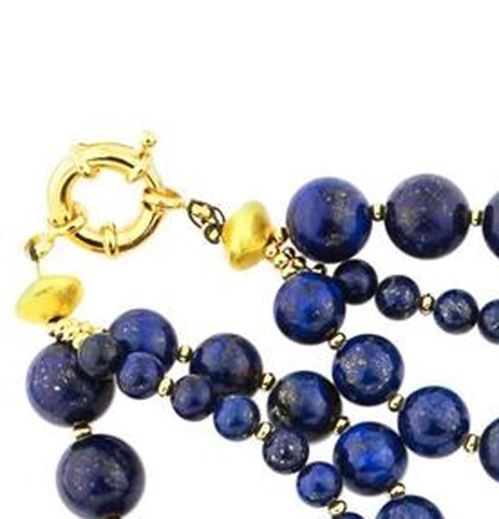 Triple strand of different shades of beautiful goldy flecked Lapis Lazuli with goldy accents make up this unique handmade necklace.
Size:  large Lapis 12.5 mm;  Length:  19 inches;  Clasp:  gold plated.
