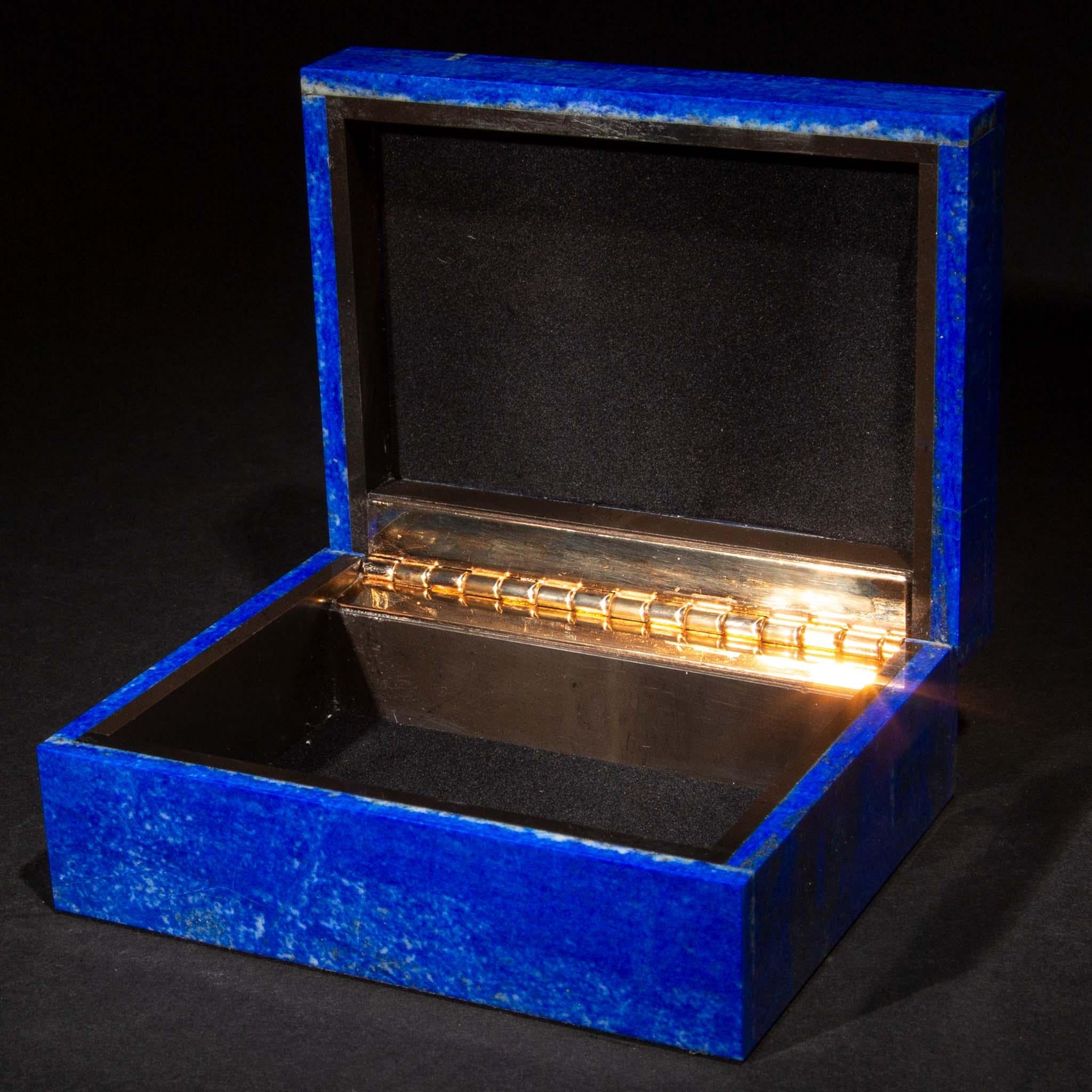 Lapis lazuli hinged boxes. Mined in Afghanistan, they were then cut, polished, and created for us in India. Lapis has been prized since antiquity for its characteristic blue color and gold speckling. It was also the most expensive pigment in a