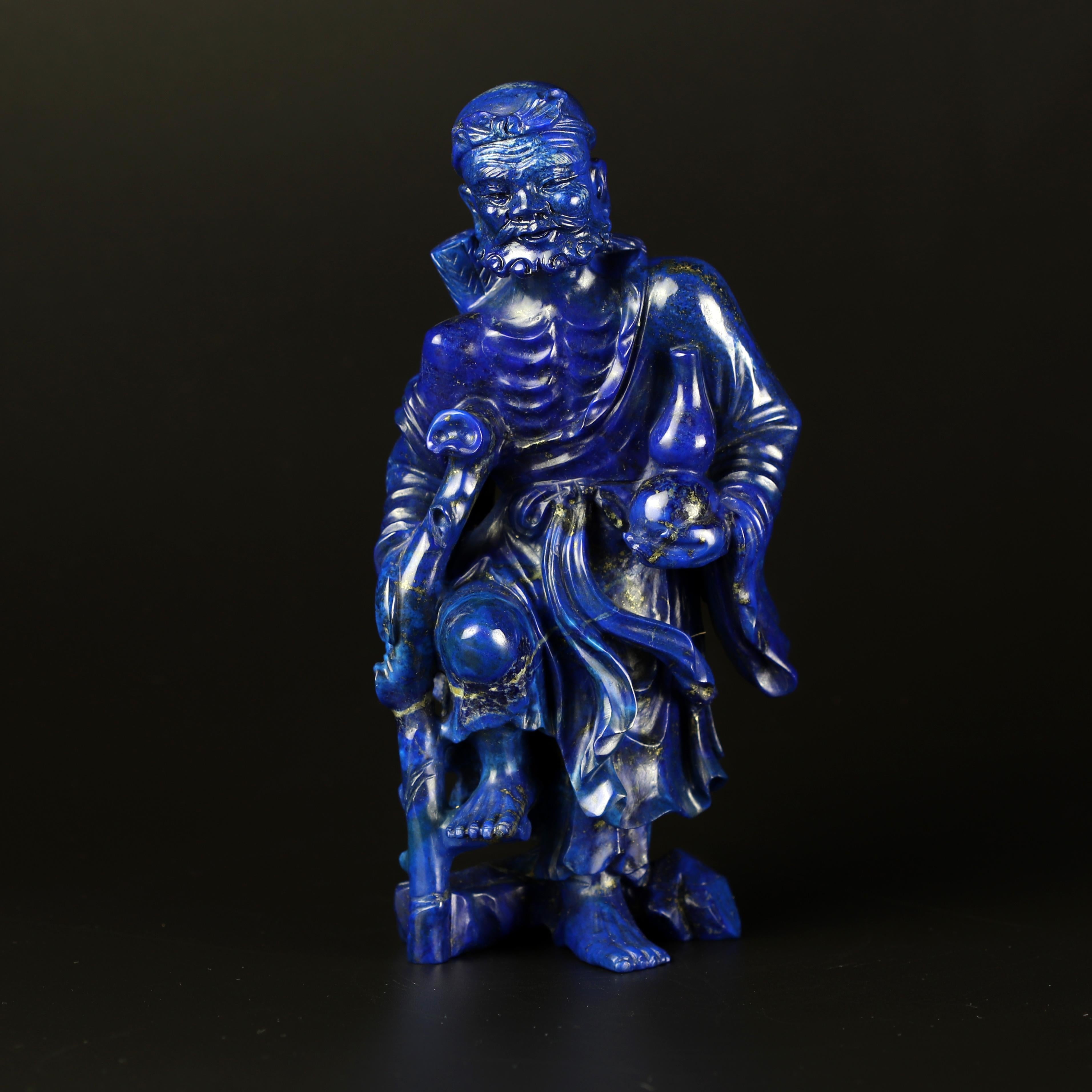 This series of Lapis Lazuli is definitely the part of the collection of which we are more fond of. This Man sculpture is from Hong Kong during the 70's. Fall in love with the passionate colour of this precious gem. Fantastic local artists carving