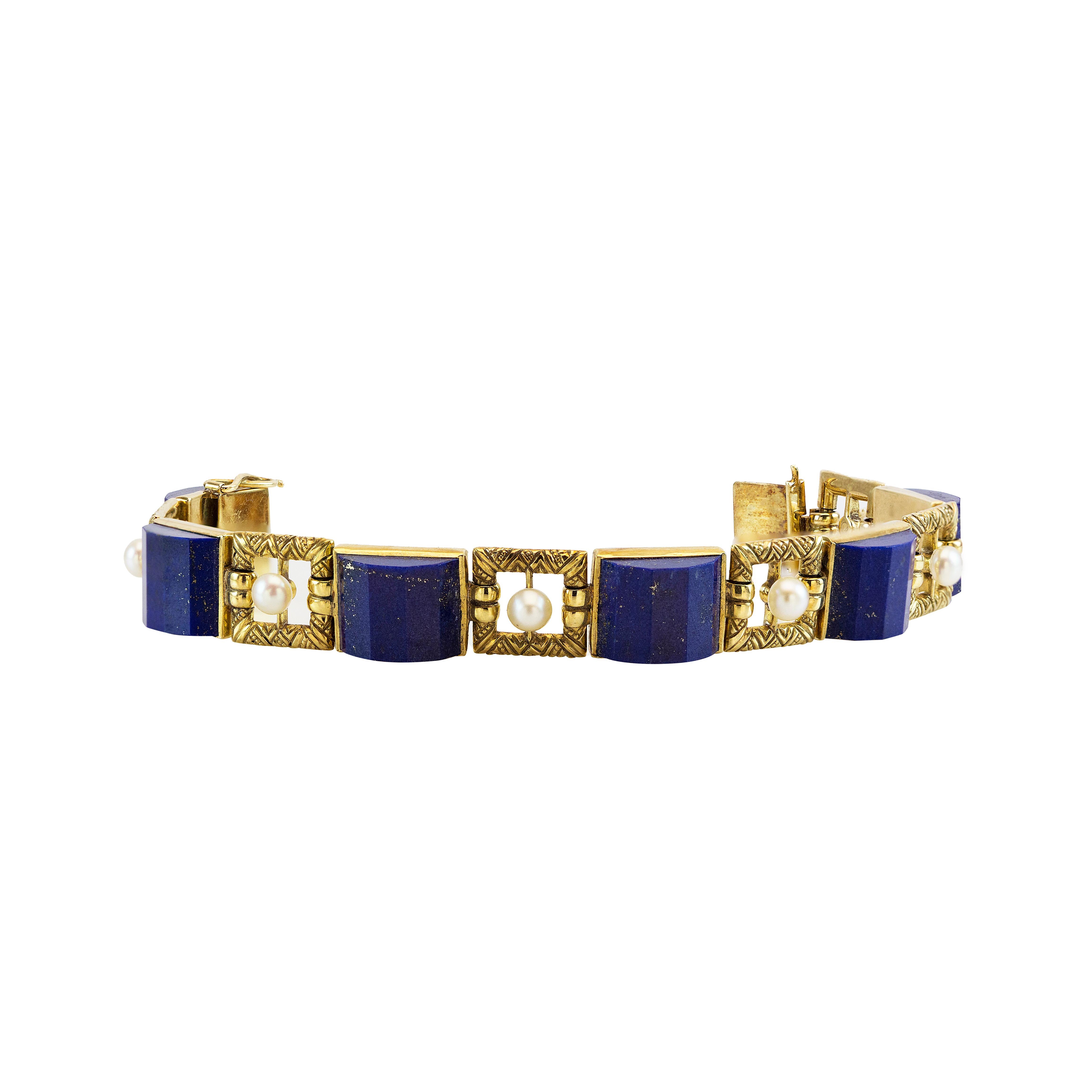 A gorgeous estate piece of bracelet featuring a natural lapis lazuli and natural saltwater pearl set in 18k yellow gold. 