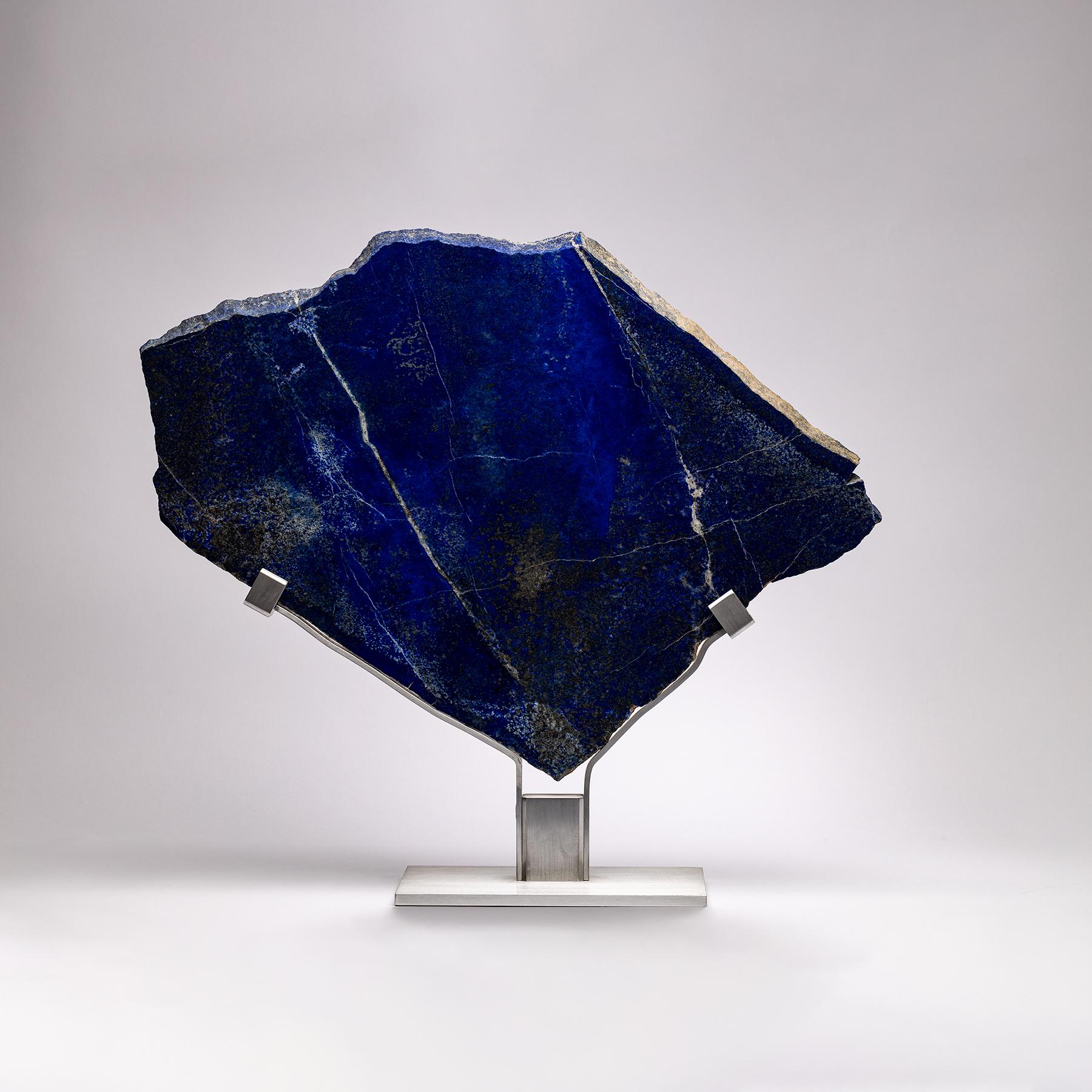 Lapis Lazuli is a deep blue metamorphic rock used as a semi-precious stone that has been prized since antiquity for its intense color.
It is a combination of lazurite, main constituent, white calcite and pyrite.
The lapis sculpture is original