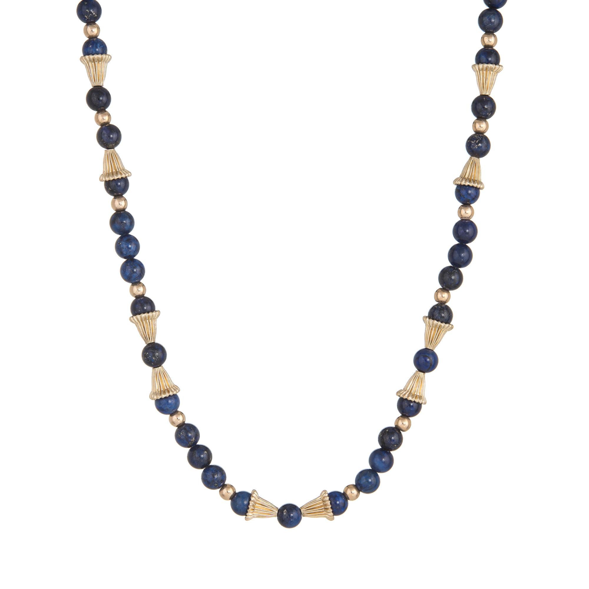 Elegant vintage lapis lazuli necklace (circa 1960s to 1970s) with 14 karat yellow gold bead separators.

Lapis lazuli beads each measure 6mm. The lapis beads are in excellent condition and free of cracks or chips.

The necklace measures 21 inches in
