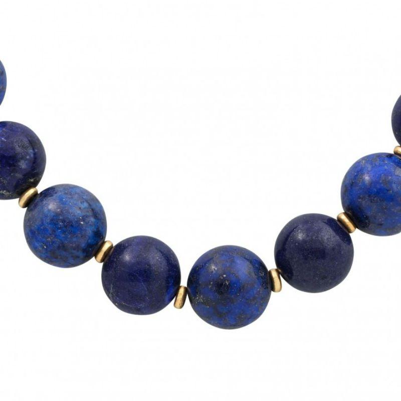 gold-colored intermediate parts, ball clasp GG 18K with 20 octagonal-cut diamonds totaling approx. 0.3 ct, good color and clarity, chain length approx. 64 cm, 20./21. Century, slight signs of wear.

 Lapis Lazuli necklace, gold colored