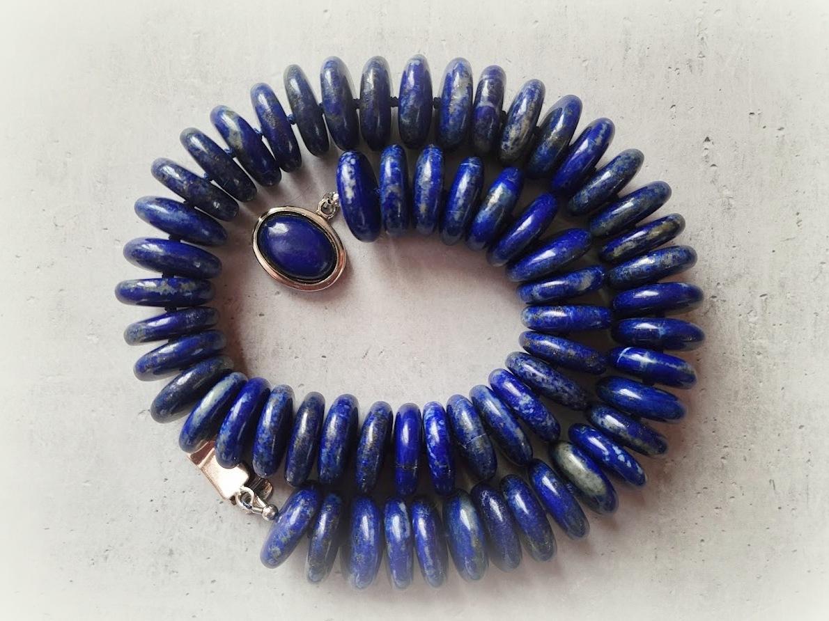 The length of the necklace is 19 inches ( 48 cm). The size of the rondelle beads is 20 mm.
The necklace is made of gems in saturated, deep, dark blue with inclusions of gold pyrite.
The beads are very high quality.
Authentic, natural color. No