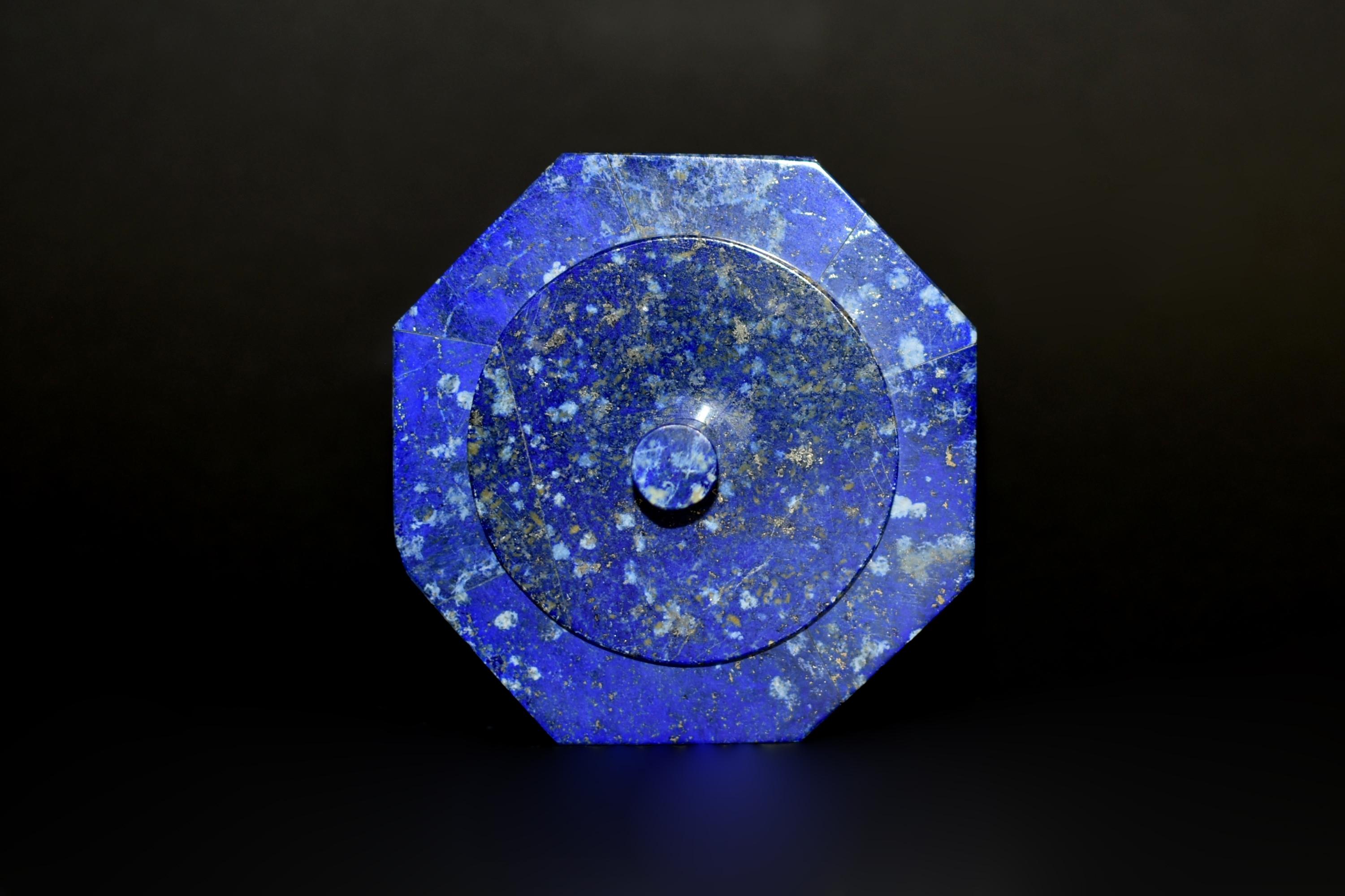 Beautiful 1.1 lb octagonal box made of the finest, grade AAA natural lapis lazuli from Afghanistan. All 8 sides are single panel lapis. A round lid with elegant finial and fine carrara marble interior. High percentage of Lazurite mineral gives the