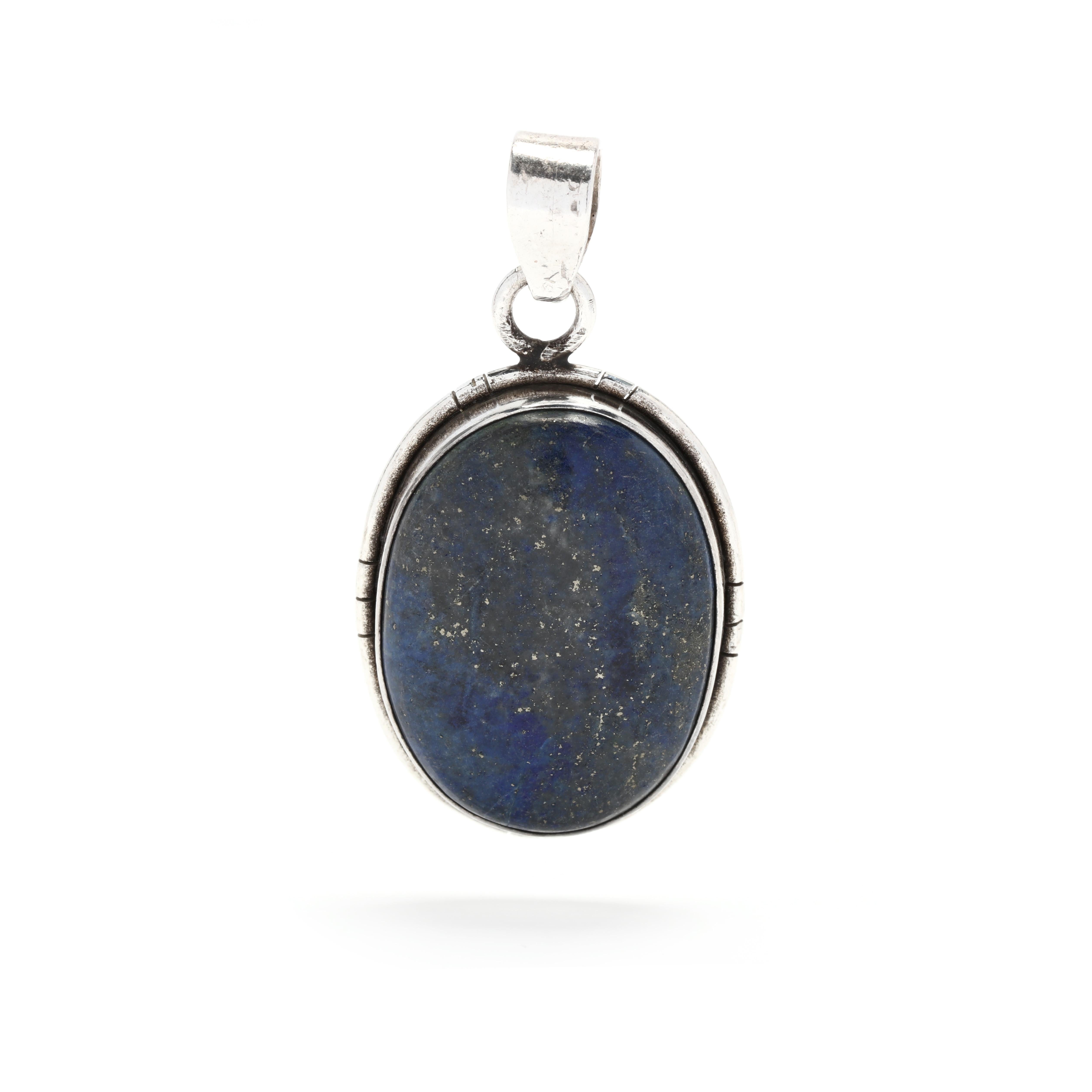 This beautiful lapis lazuli cabochon pendant is made of sterling silver and set with a stunning blue stone. The pendant features a unique cabochon cut to reveal the mesmerizing deep blue color of the lapis lazuli. The stone is encased in an elegant