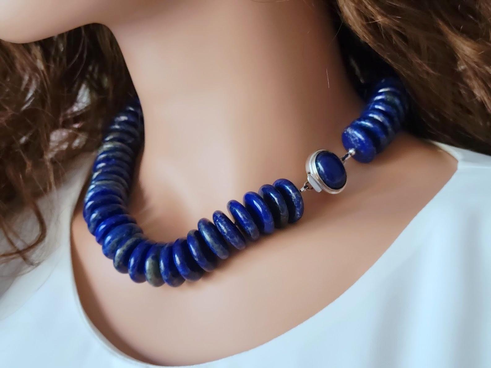The length of the necklace is 19 inches ( 48 cm). The size of the rondelle beads is 20 mm.
The necklace is made of gems in saturated, deep, dark blue with inclusions of gold pyrite. The beads are very high quality.
Authentic, natural color. No
