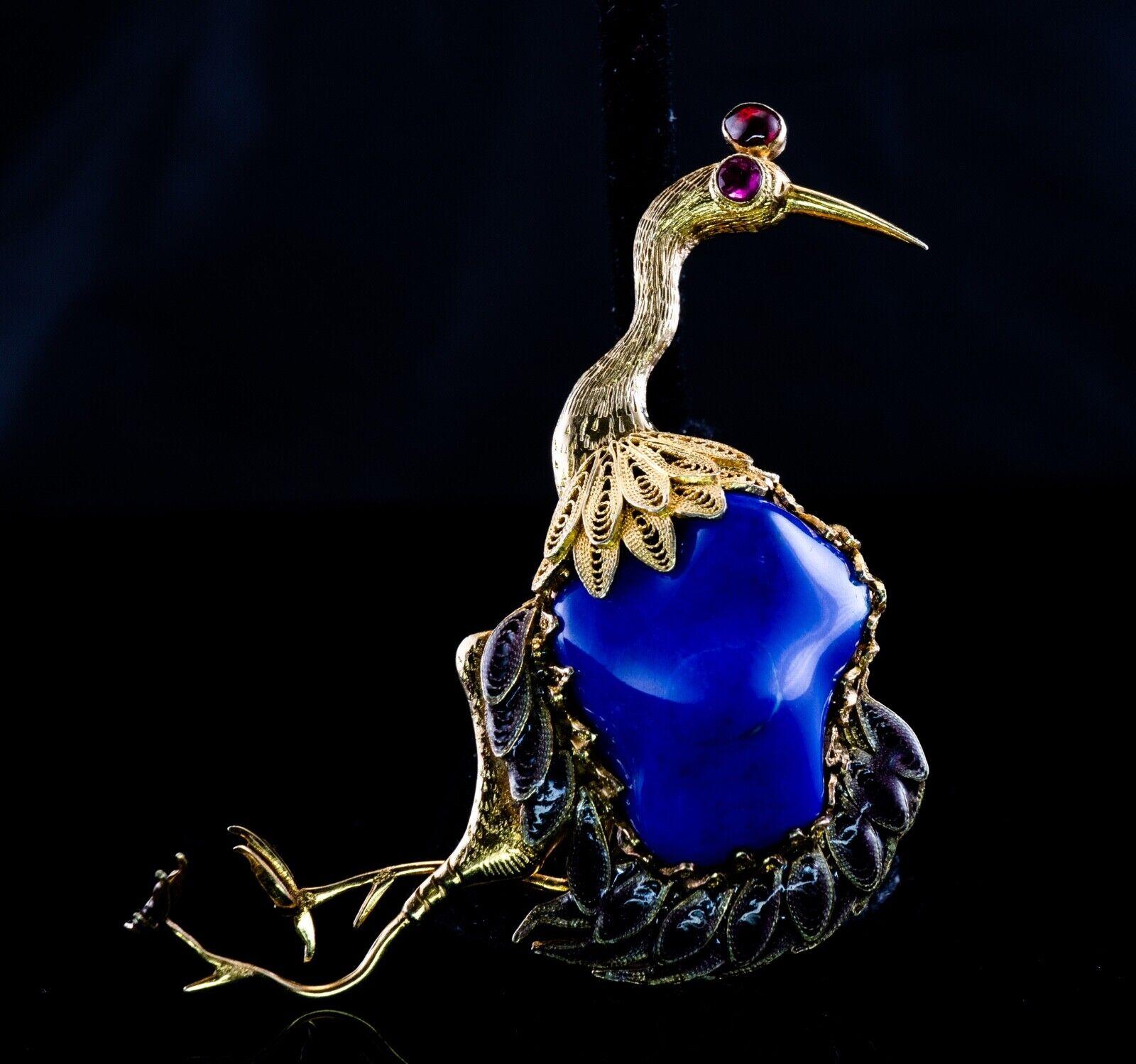 Lapis Lazuli Ruby Brooch Peacock Bird 14K Gold Vintage

This exceptional whimsical Lapis Lazuli bird brooch is crafted in solid 14k Yellow Gold. The center free form genuine Lapis Lazuli measures approximately 3/4