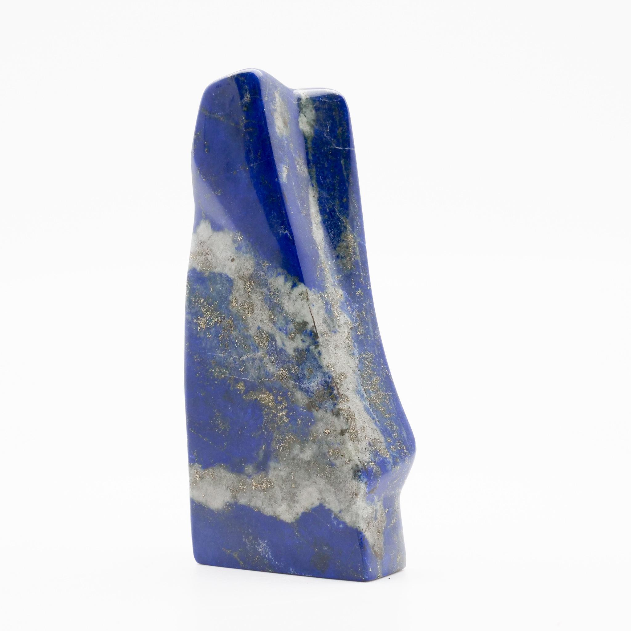 Beautifully polished lapis lazuli mineral specimen from Afghanistan. This semi-precious stone has been prized since antiquity due to its intense, beautiful blue coloring and golden speckles (pyrite flecks). It was also used in the Fine arts, in a