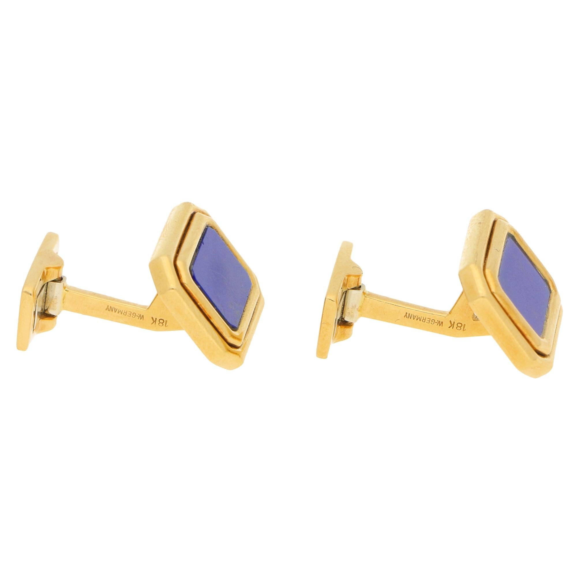 A pair of lapis lazuli swivel-back cufflinks in 18-karat yellow gold. Each cufflink features a rectangular lapis lazuli tablet within a double row yellow gold frame. Dimensions: 2.7x1.4cm.