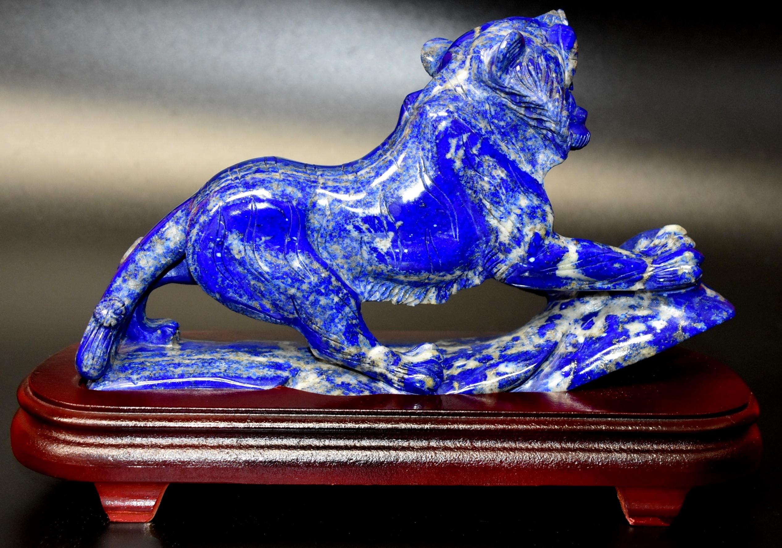 A larger, beautiful all natural lapis lazuli tiger sculpture. The 3 lb stone's is stunning in bright cobalt blue with beautiful spots of white and glittering gold. The beauty of this precious stone is enhanced by the fantastic carving work. The