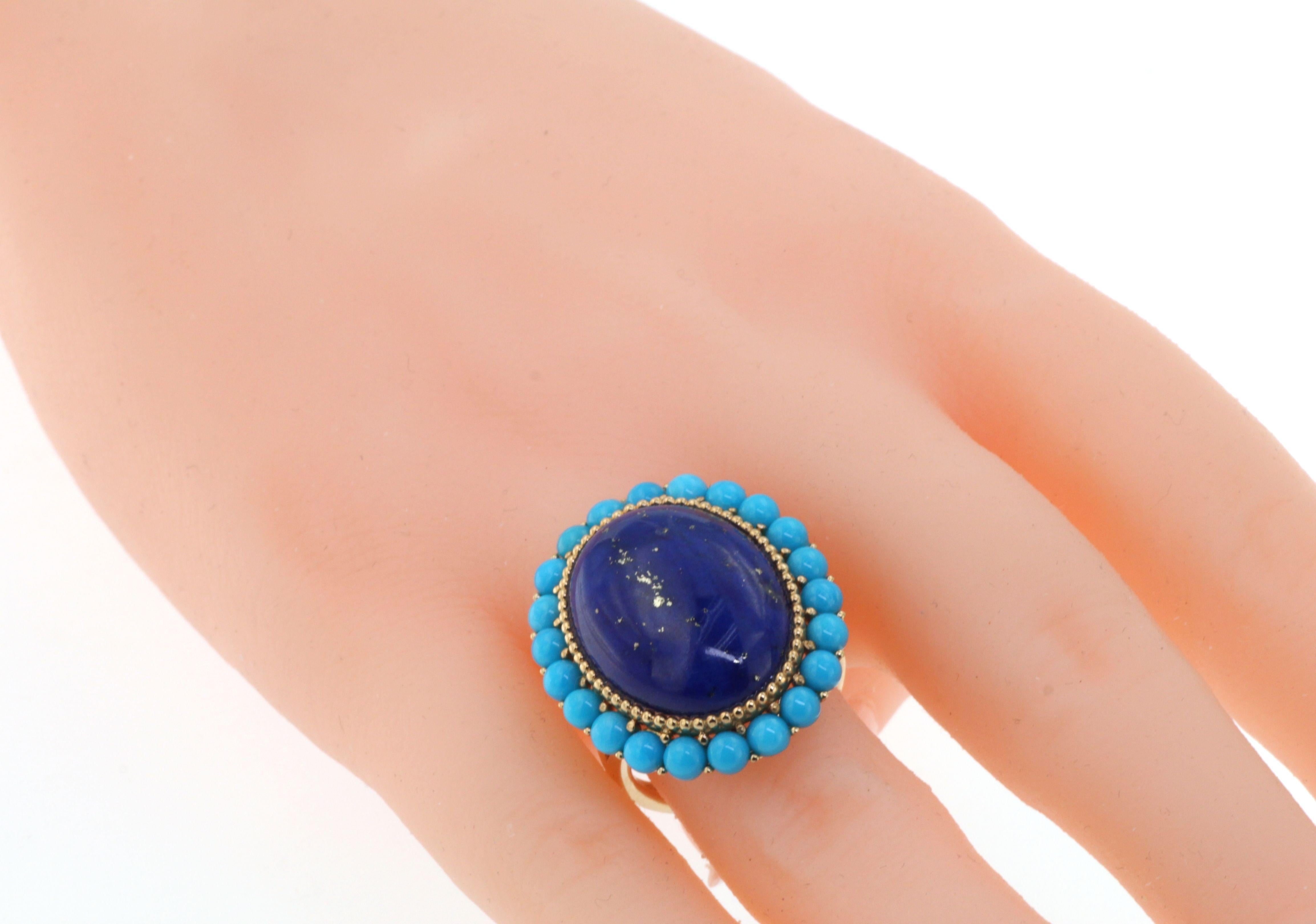 This ring features a 11.80 carats oval shape lapis lazuli.  Lapis Lazuli is surrounded by gold beads and 0.63 carats of round turquoise. Ring is set in 14 karat yellow gold. Matching earrings are available, please visit our store-front to view