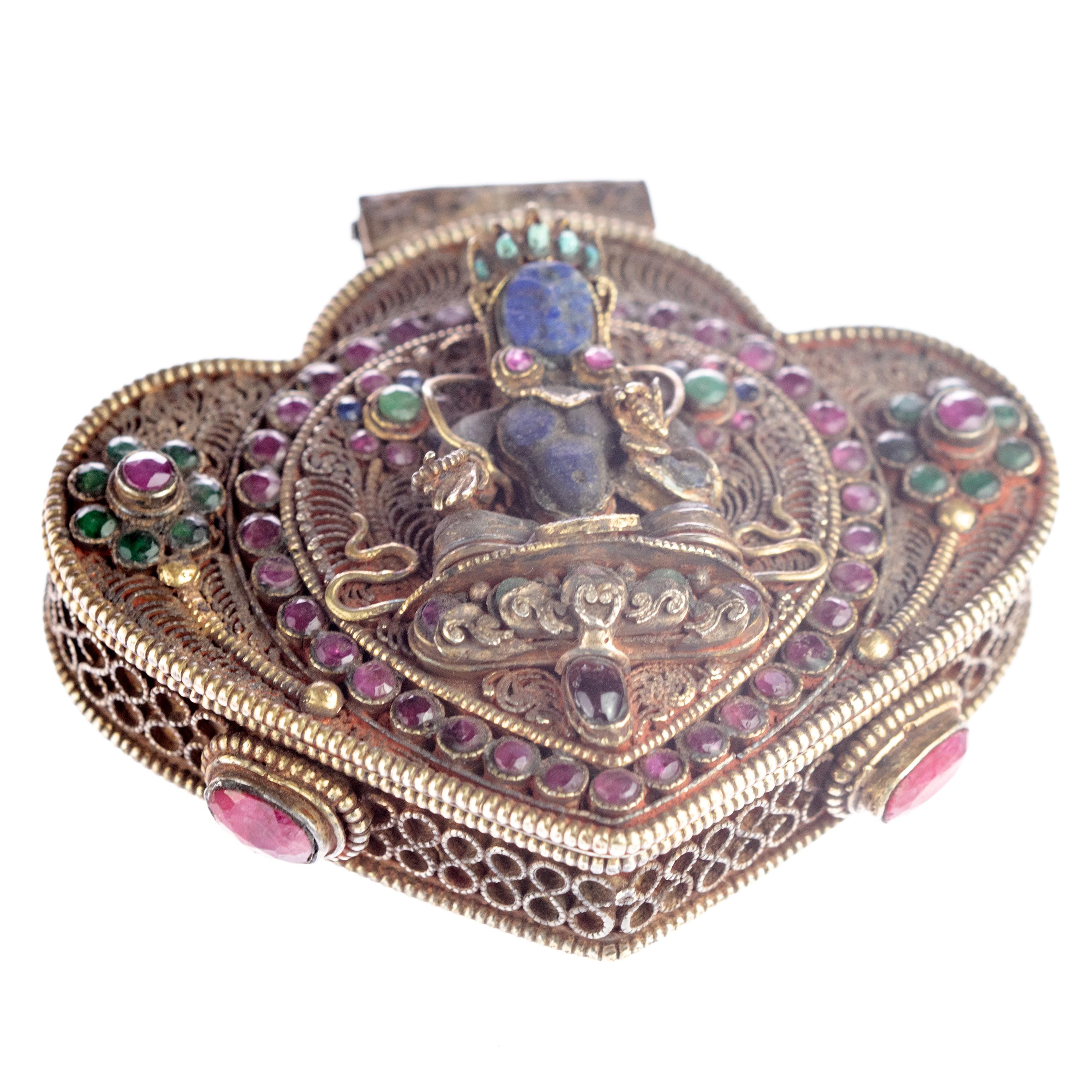 Spectacular Tibetan Buddhist Prayer Pendant Jewelry Box delicately decorated with Lapis Lazuli Turquoise Ruby Emerald and Corals. An article full of color and history, showing emphatically Tibetan culture, the importance of spirituality and the