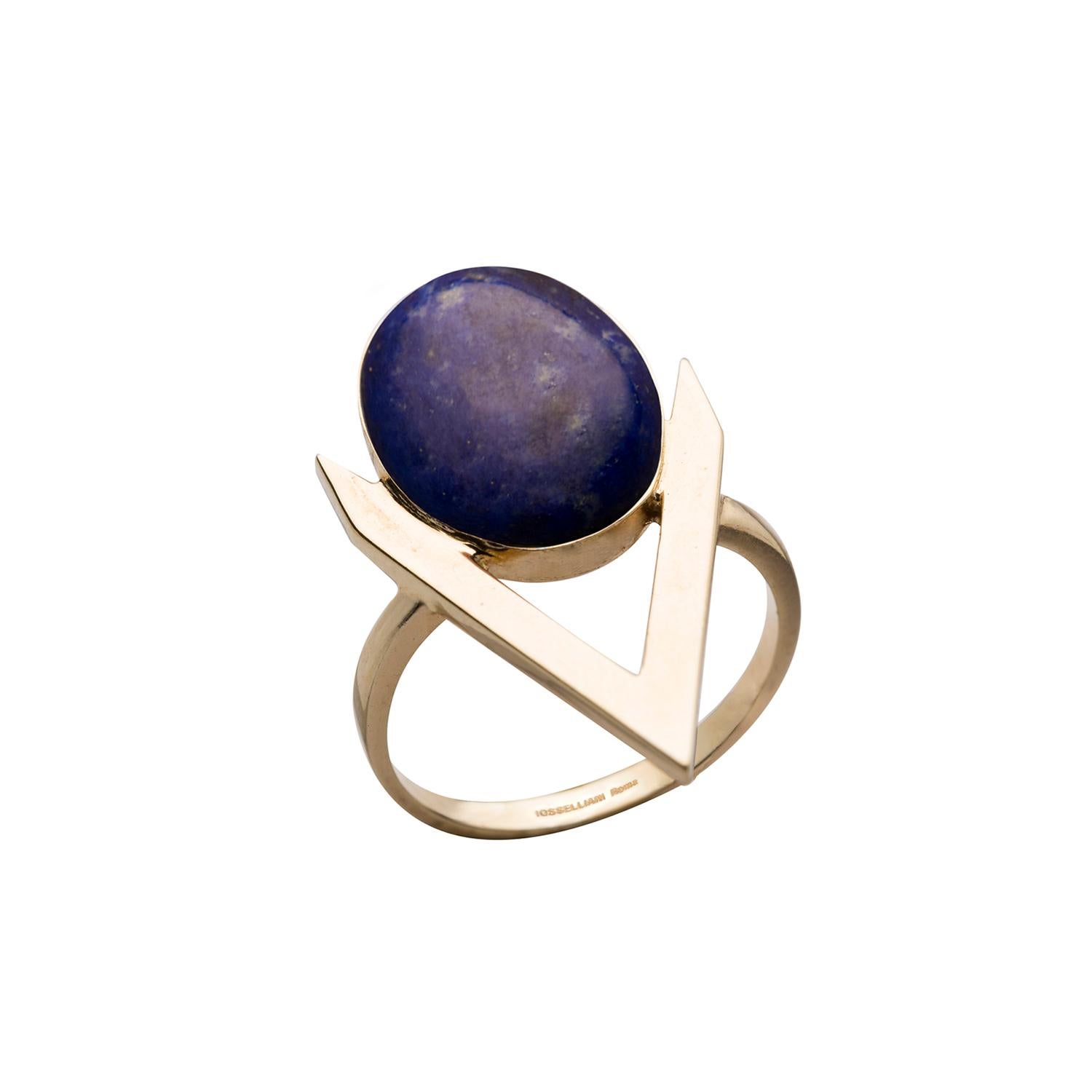 Add jewellery with a modern, feminine attitude to your outfit with this 9 Karat gold ring from Iosselliani.  Crafted in Italy, the ring features a medium sized lapis lazuli cabochon framed into a V shape. Perfect as a gift of love, the ring is