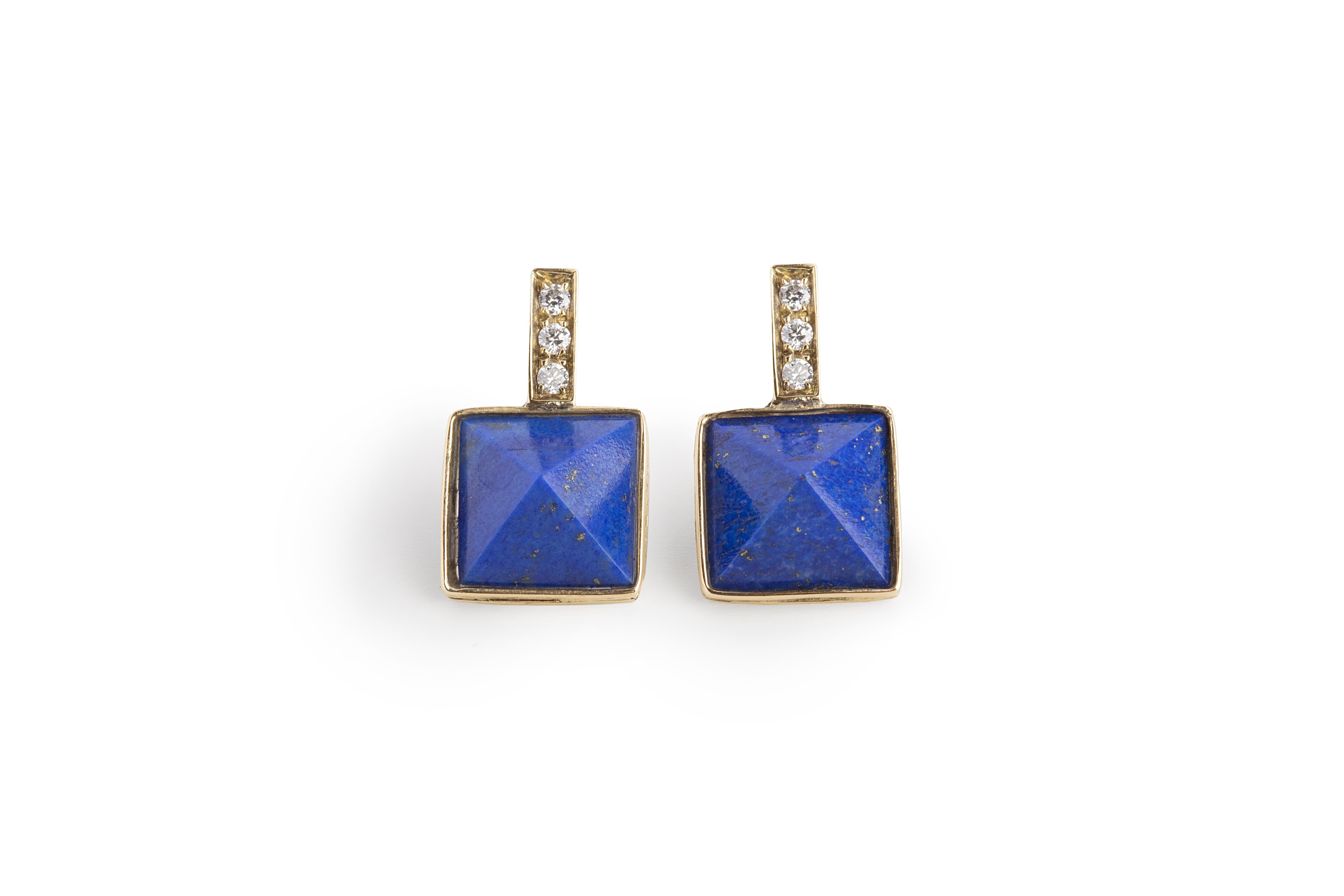 Rossella Ugolini Design Collection, Lapis Lazuli Diamonds Stud Earrings.
Openly inspired by the Italian Castle Architecture, this beautiful pair of design stud earrings is handcrafted in 18 karat yellow gold enriched with luminous 0.12 karat