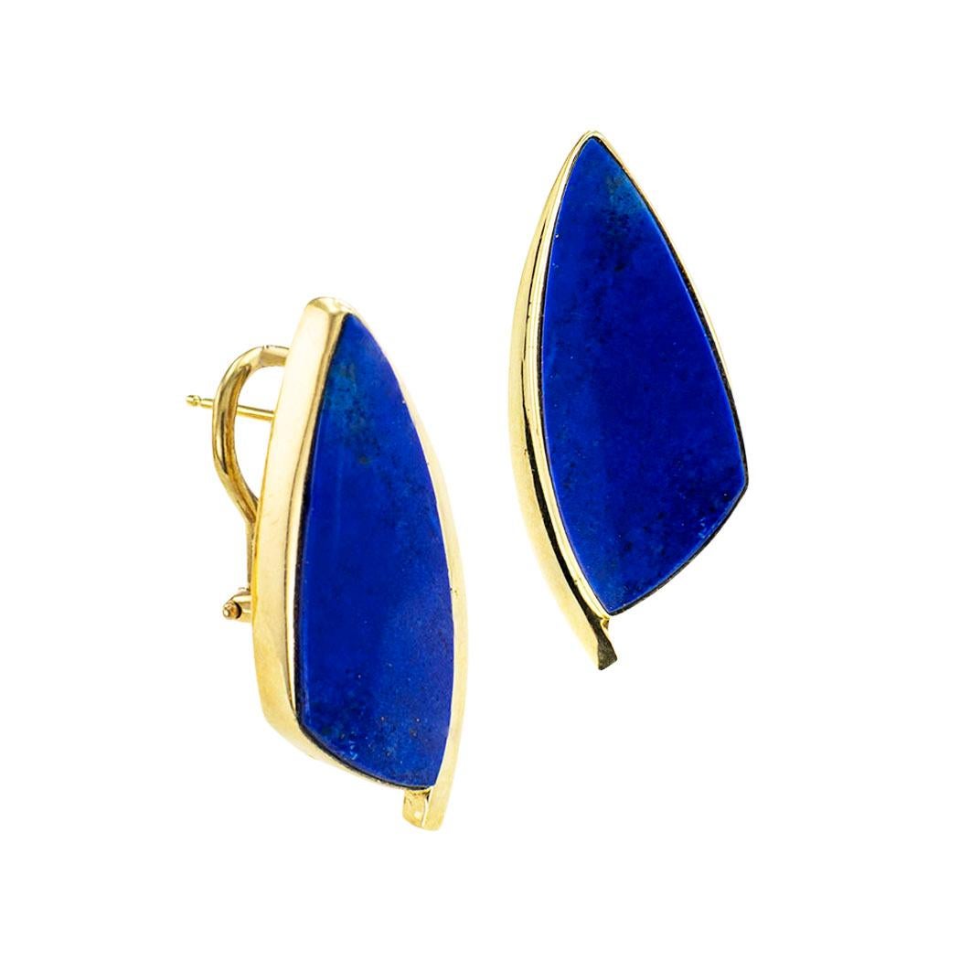 Lapis lazuli and yellow gold Modernist-inspired omega clip with post earrings circa 1990. *

ABOUT THIS ITEM:  #E-DJ6322C. Scroll down for specifications.  The designs feature Modernist-inspired motifs composed by curved sharp, simple lines to