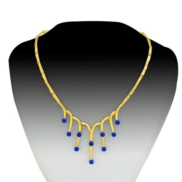 Lapis lazuli and matt yellow gold necklace circa 1970. *

ABOUT THIS ITEM: #N-JH51922E. Scroll down for specifications. With its fluid construction, it fits and conforms beautifully to the neck. Not to be overlooked is the clever use of the matt