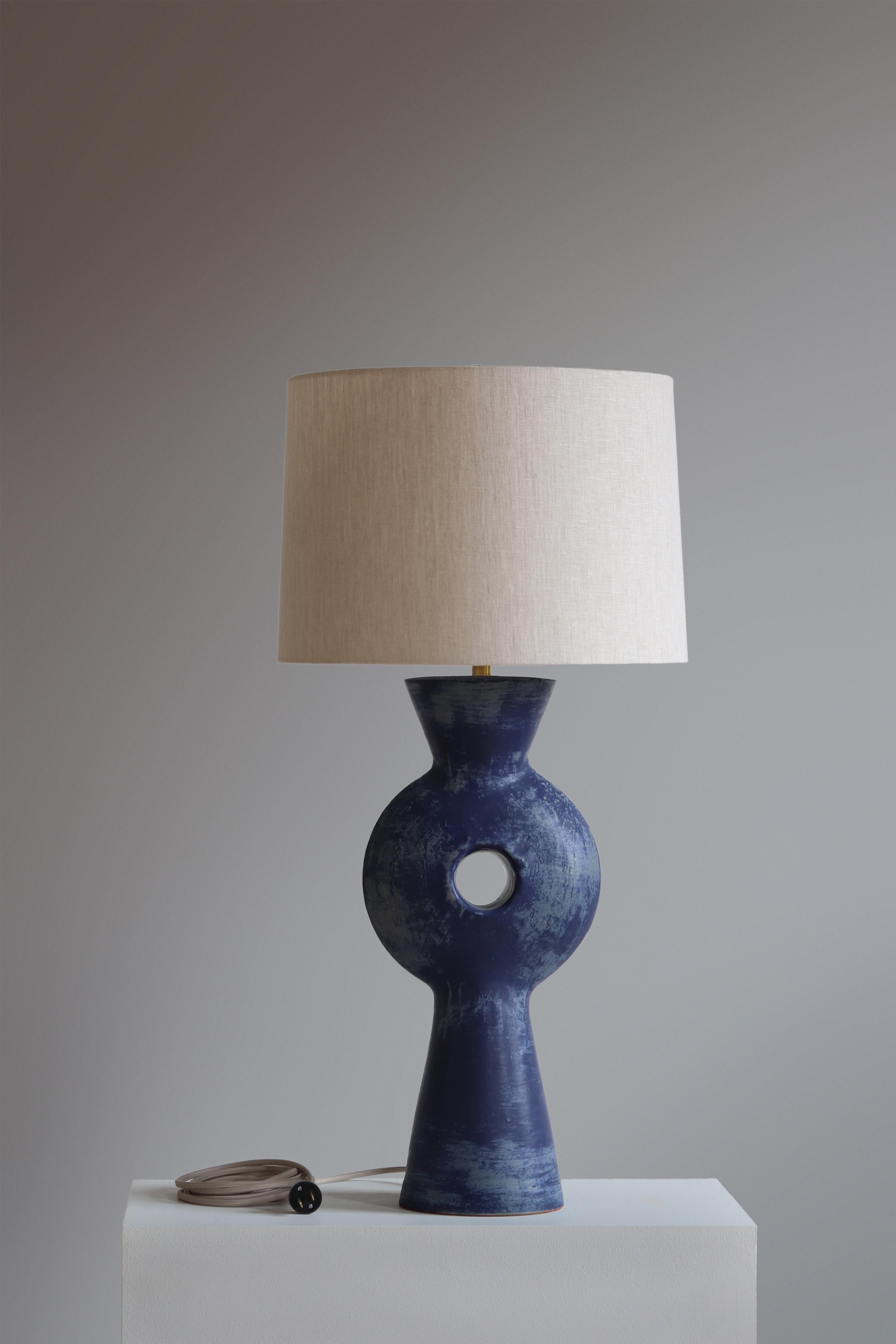 Lapis Linus Table Lamp by Danny Kaplan Studio
Dimensions: ⌀ 41 x H 82 cm
Materials: Glazed Ceramic, Unfinished Brass, Linen

This item is handmade, and may exhibit variability within the same piece. We do our best to maintain a consistent product,