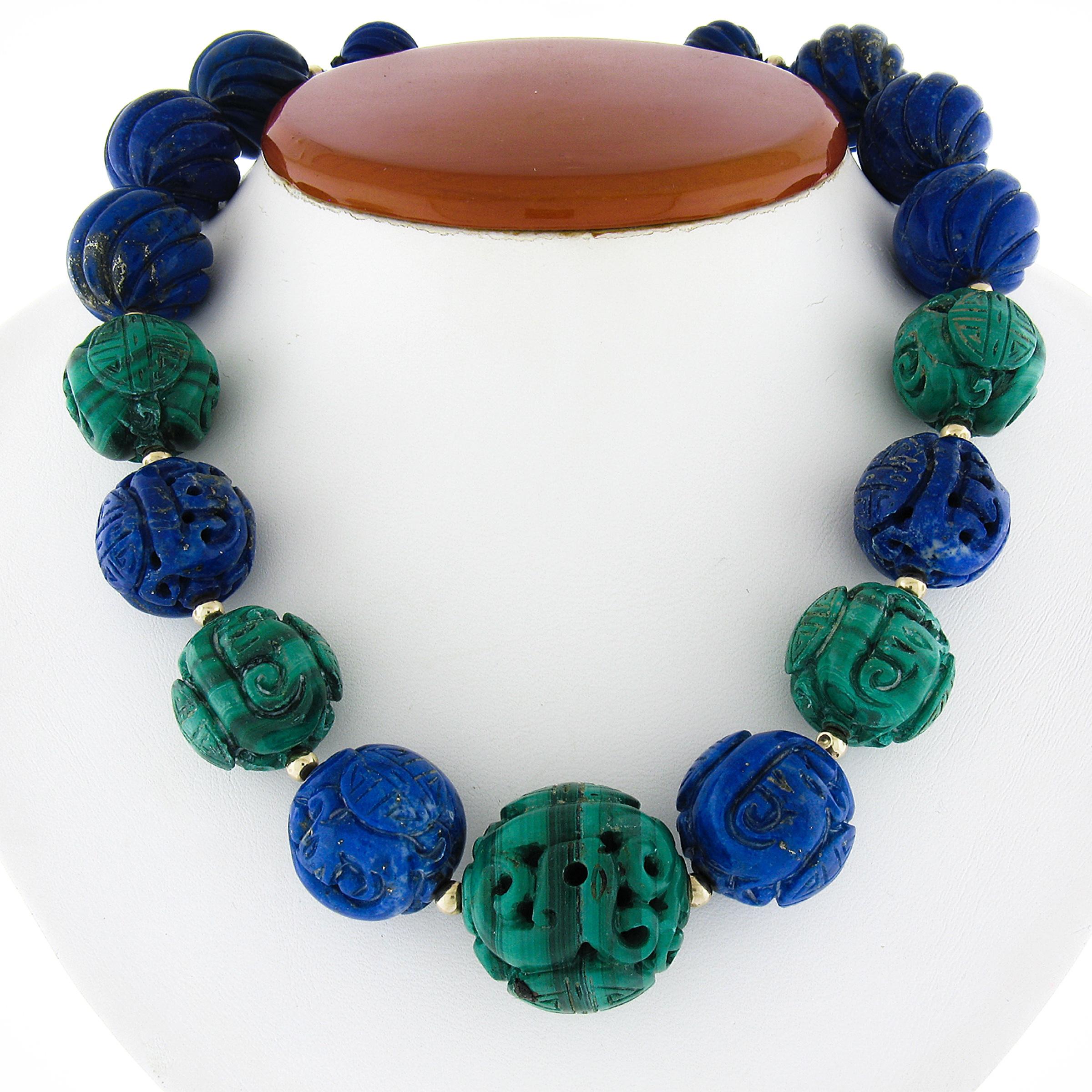 --Stone(s):--
(12) Natural Genuine Lapis Lazuli - Carved Round Bead Shape - Strung - Blue Color - 14.3 to 20.9mm each (certified)
(5) Natural Genuine Malachite - Carved Round Bead Shape - Strung - Banded Green Color - 20 to 25.8mm