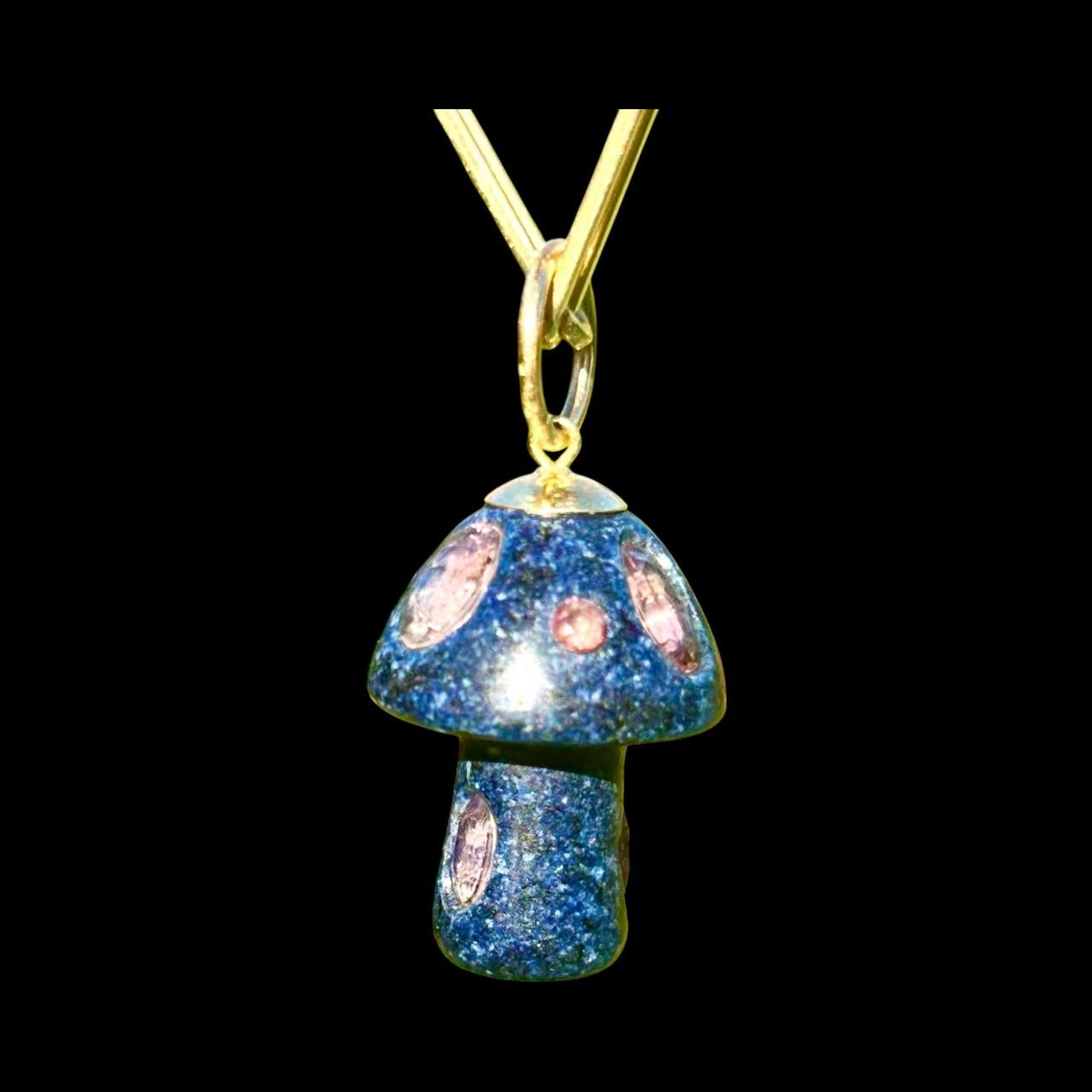 MAGIC MUSHROOM Pendant 

Lapis, Pink Tourmaline, 14k Gold

Feel the magic wearing this one-of-a-kind pendant that measures 1” in length (excluding 14k gold ring bail). 

This magical fungi carved from beautiful lapis has five oval pink tourmalines