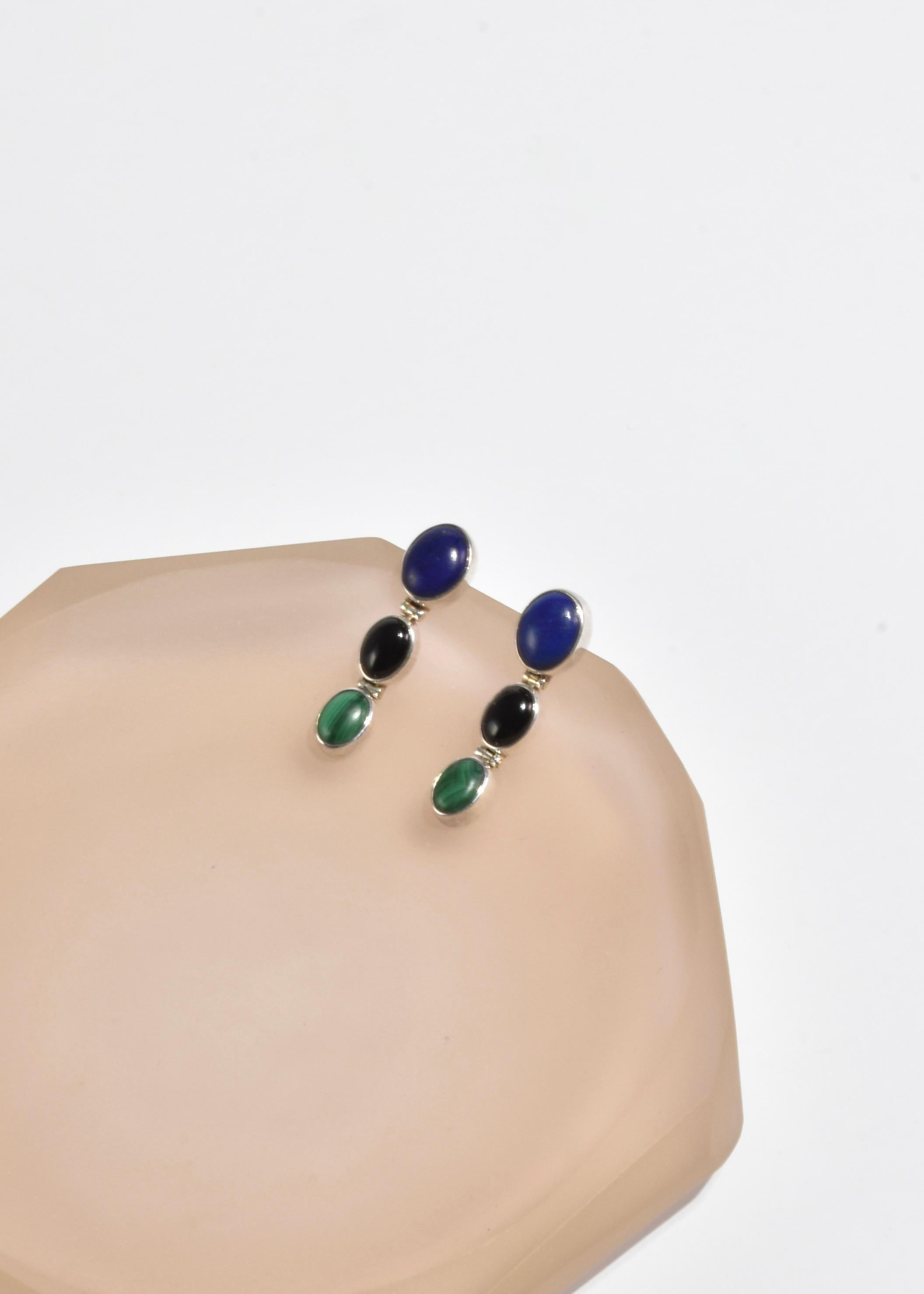Beautiful vintage silver earrings with cascading oval lapis, onyx, and malachite stones. Pierced, stamped 925.

Material: Sterling silver, onyx, malachite, lapis lazuli.