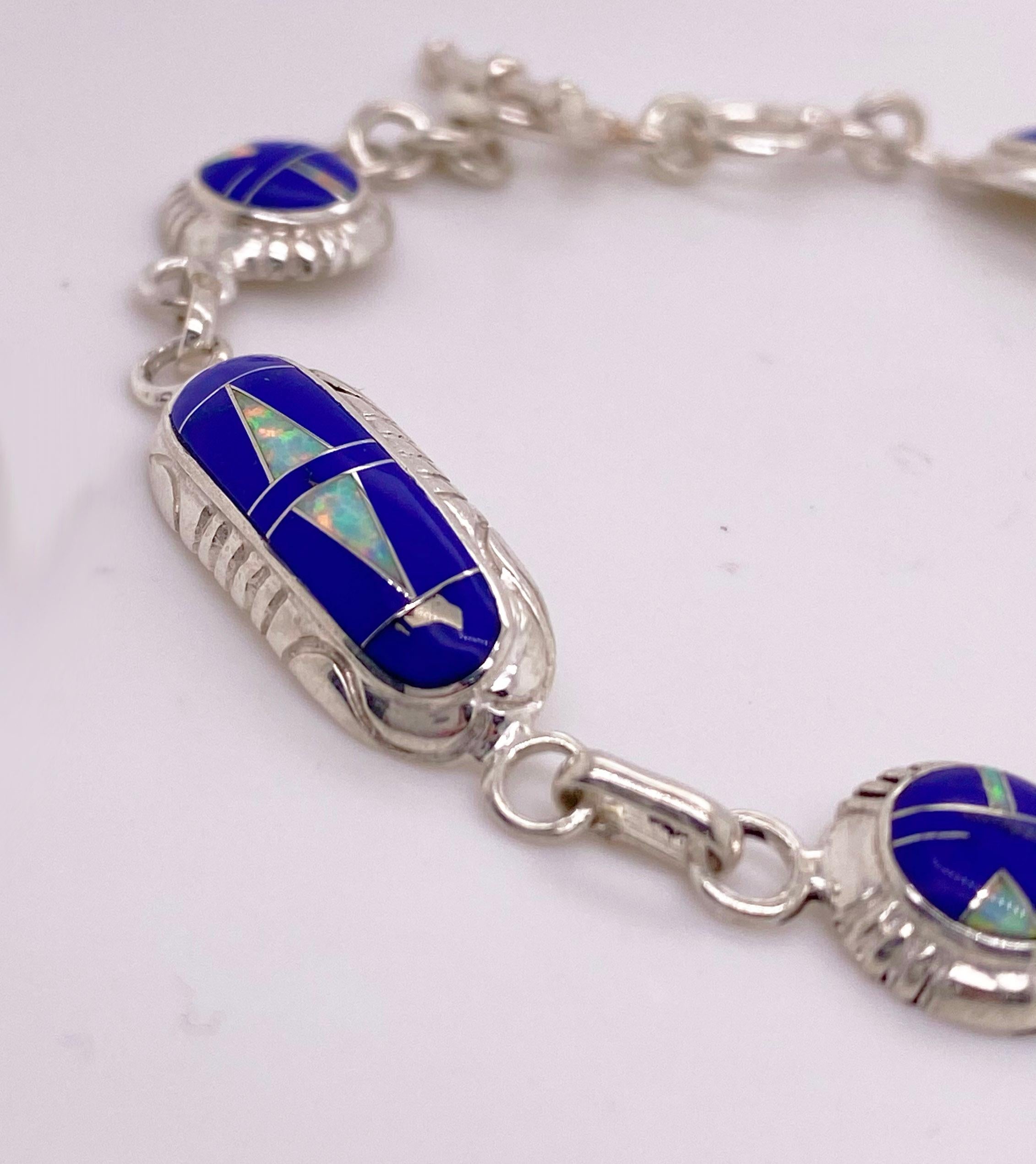 Indian designed and made, this bracelet has loads of personality! The lapis is the highest grade as a rich blue color and the triangle inlay of opal really “pops” off the blue of the lapis. The opal is genuine material and is a lovely pink and light