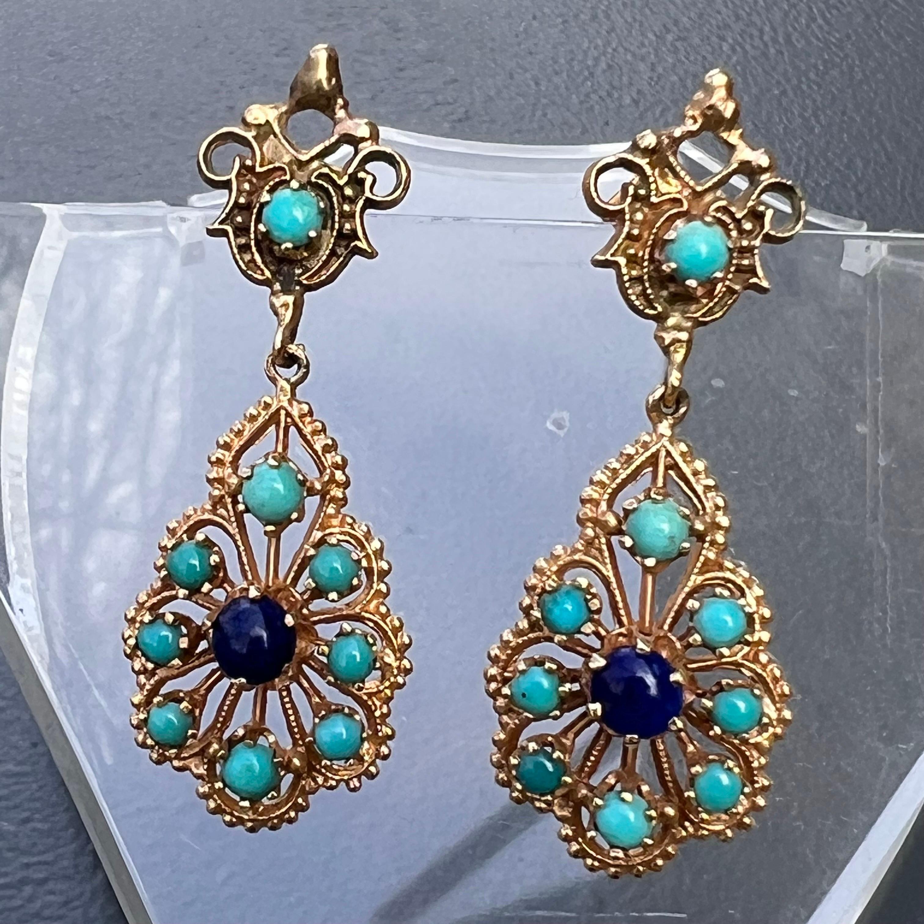 Elegant vintage Victorian revival 14kt solid gold dangle drop earrings for pierced ears with 9 Persian turquoise and two prong set lapis beads /cabs set on an openwork gold base . Front of earrings have small gold bead work border .
marked 14kt on