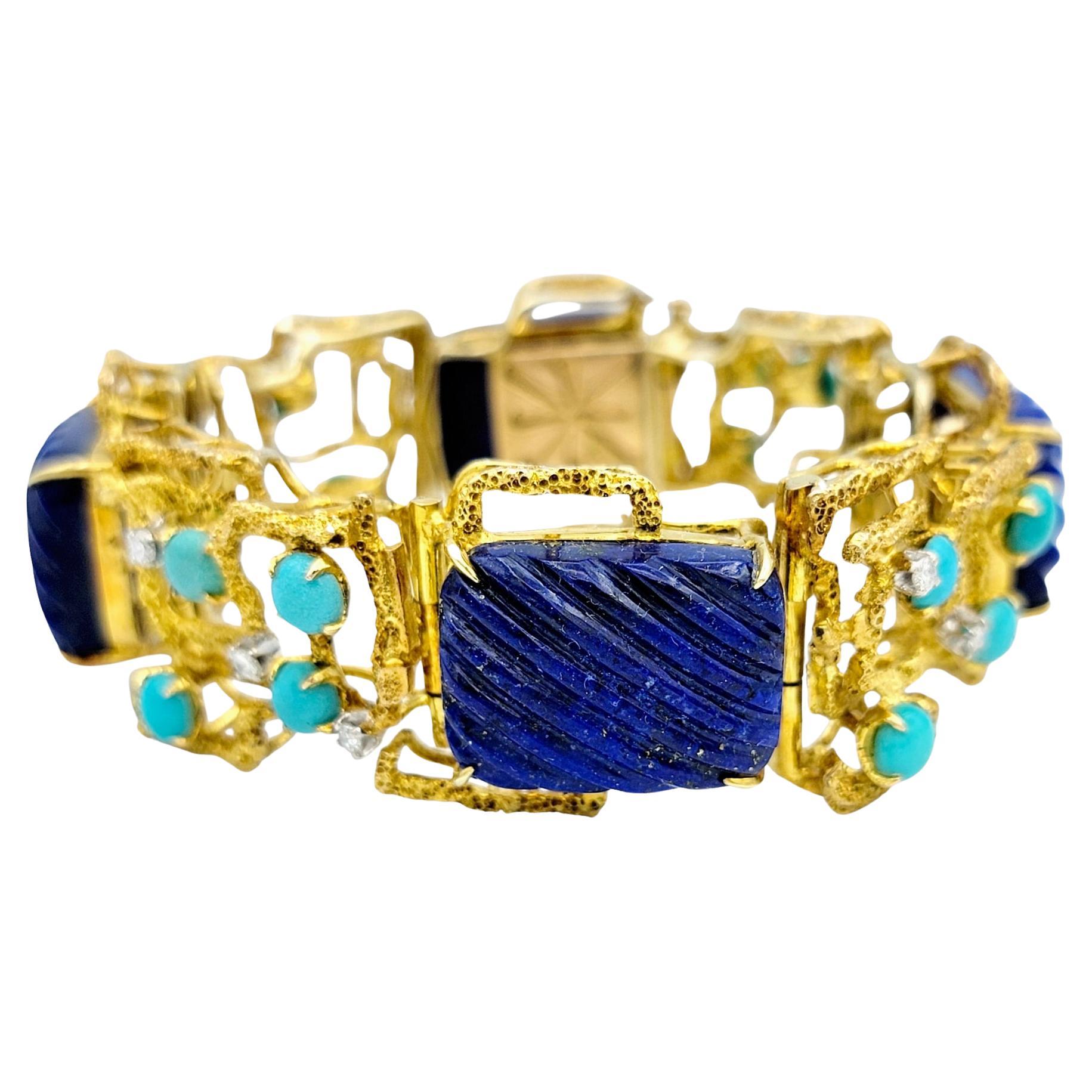 This unique and colorful chunky gold link bracelet is a captivating work of art, seamlessly blending geometric precision with the allure of natural gemstones. Each alternating link showcases a cushion-cut lapis lazuli gemstone, masterfully carved to