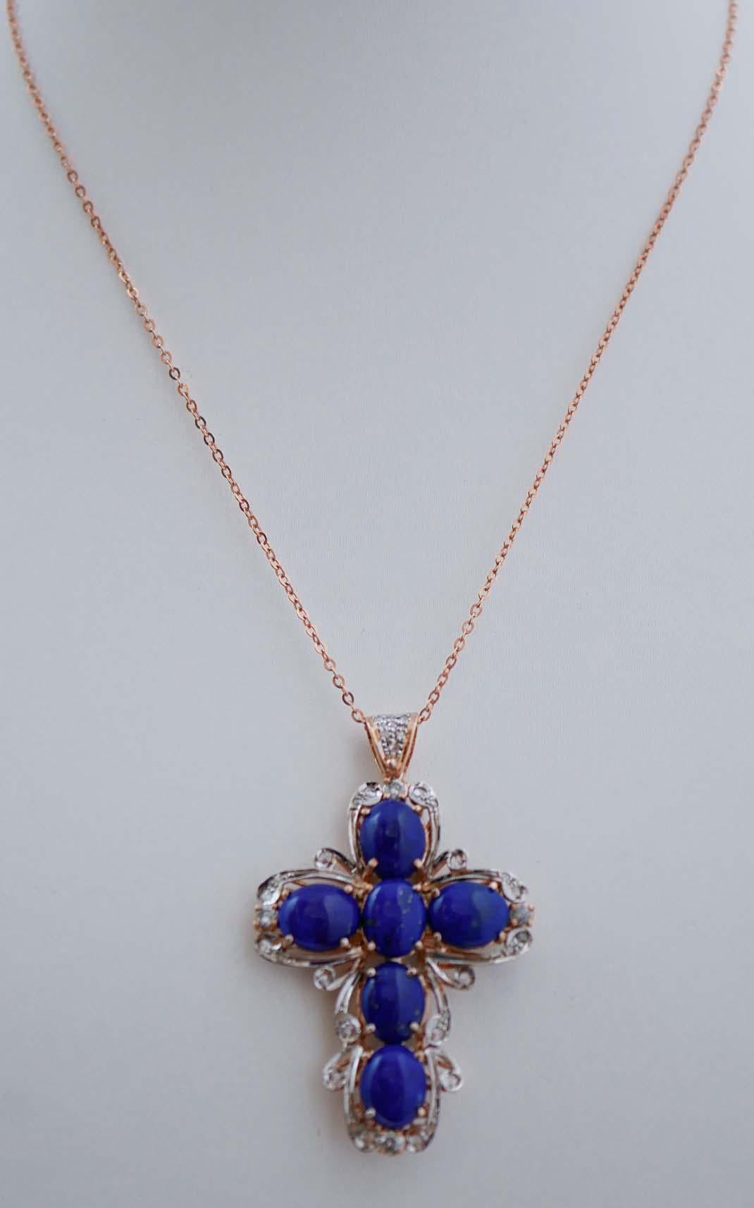 Fantastic cross pendant in 9 kt rose gold and silver structure mounted with lapislazuli surrounded by diamonds. The silver chain is included.
This pendant was totally handmade by Italian master goldsmiths and it is in perfect conditions.
Diamonds