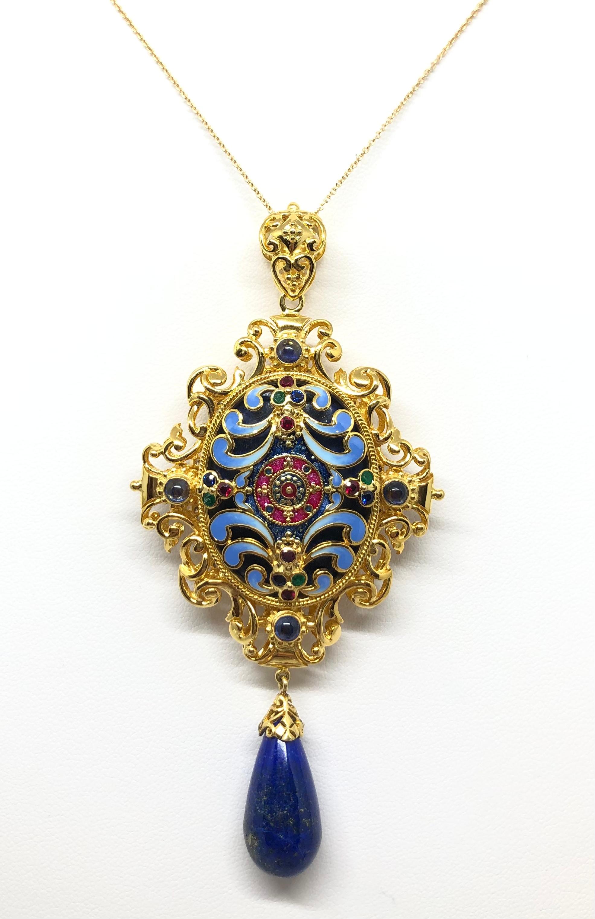 Lapiz Lazuli 63.83 carats, Lapiz Lazuli 20.03 carats, Blue Sapphire 0.20 carat, Cabochon Blue Sapphire 1.37 carats, Ruby 0.35 carat, Cabochon Ruby 2.13 carats and Emerald 0.18 carat Pendant set in 18 Karat Gold Settings
(chain not included)

Width: