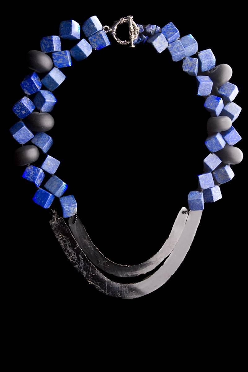 Contemporary double stranded necklace with cubic lapizlazuli, mate finish, oval black onix beads and 2 Aztecs long curved obsidian flints ca. 1350-1521 AD. Modern new string and clasp.
