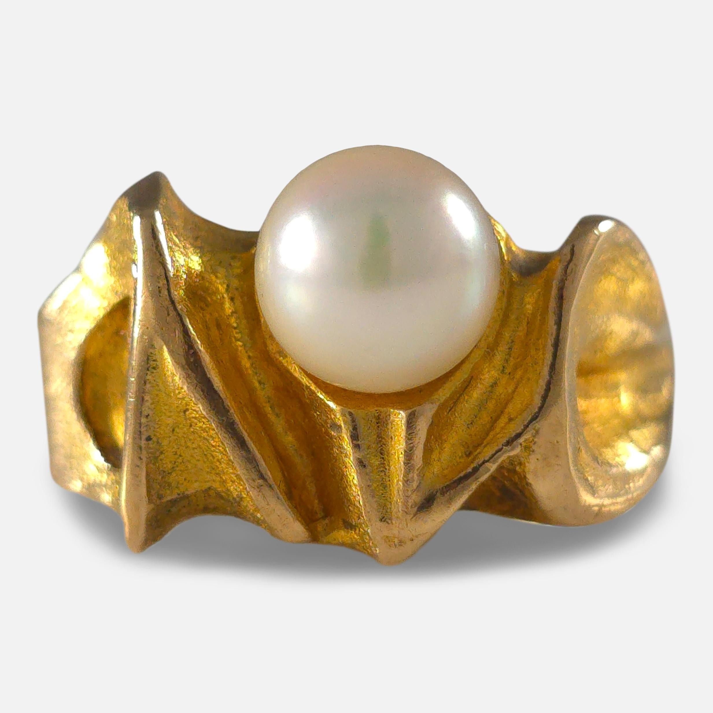 A 14ct yellow gold pearl 'Lapintaika' ring by Björn Weckström for Lapponia, dated 1970. The ring features a creamy white pearl set in a distinctive modernist design.

• Assay: Stamped with Lapponia maker's mark, '585' for 14 carat gold, 'FINLAND',