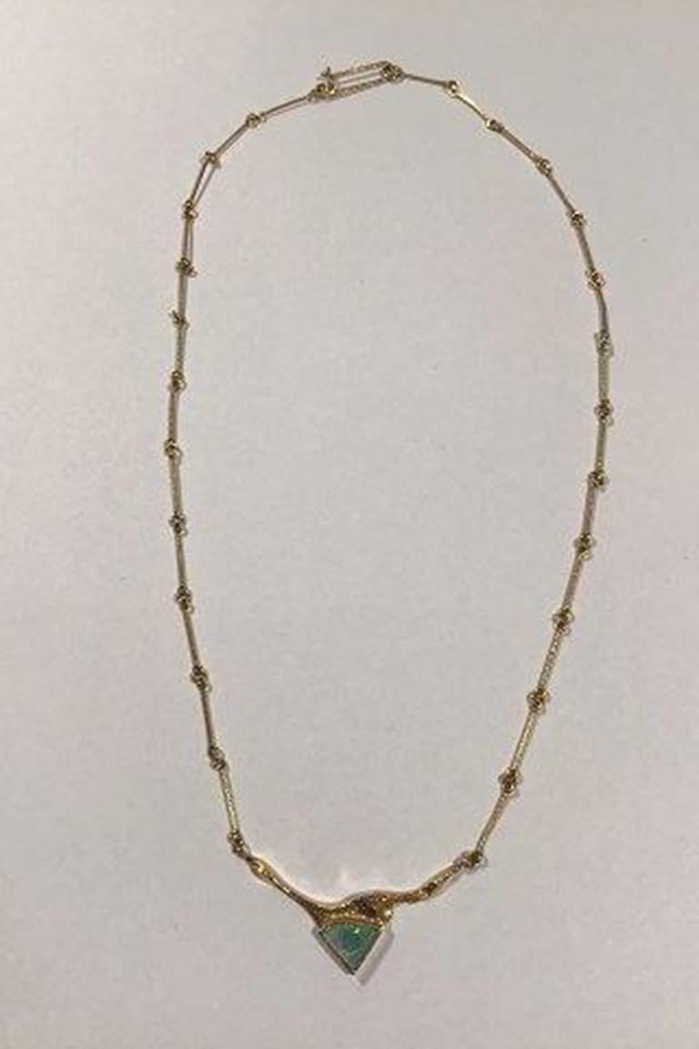 Lapponia 14K Gold Necklace with Opal.

Measures 41 cm(16 9/64 in) Weight 4.3 gr/0.15 oz.