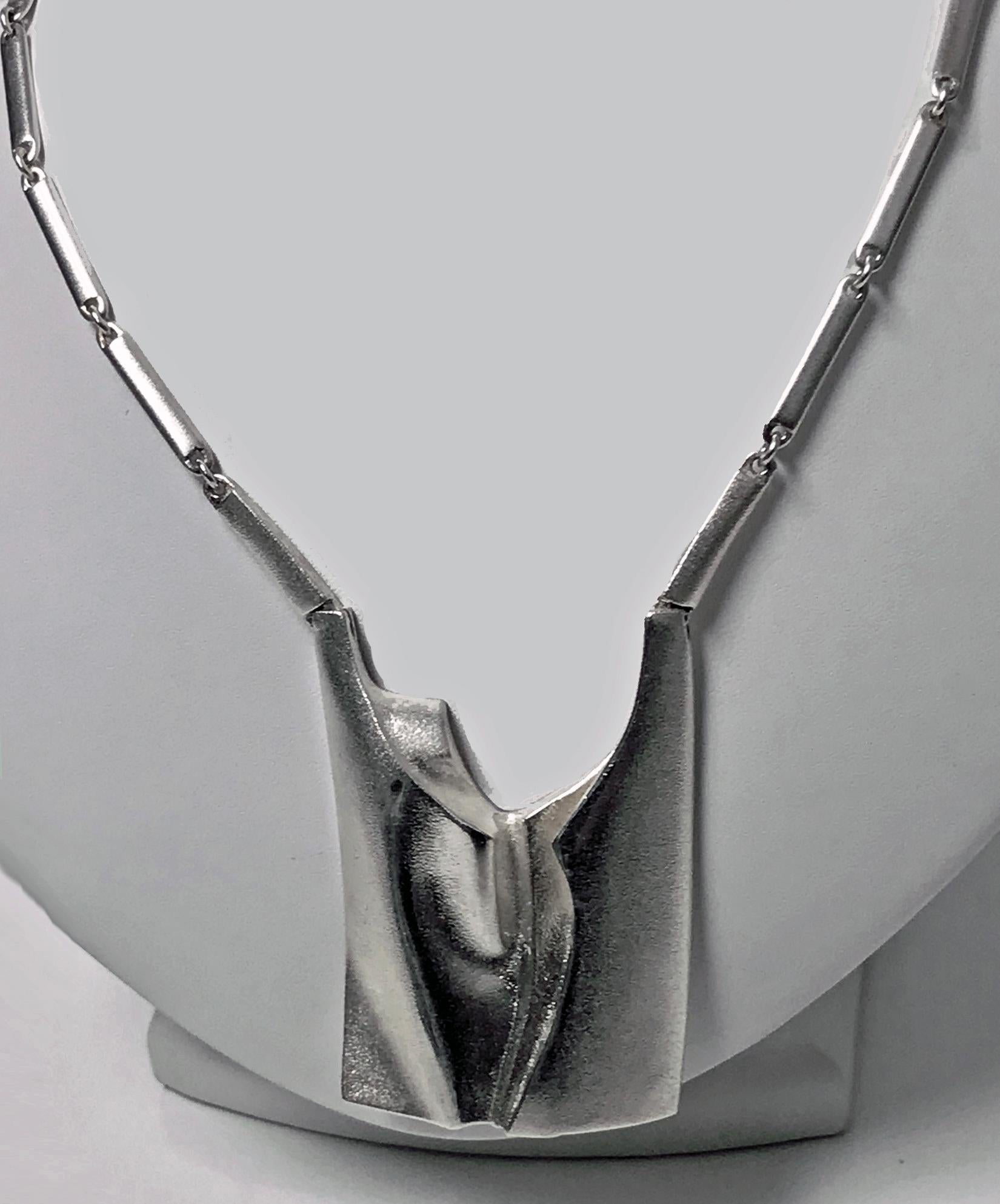 Lapponia Sterling Necklace Finland 1994, designed by Björn Weckström for Lapponia. Rectangular abstract modernism design, together with knife edge and loop chain. Full marks. Length approximately 32 inches. Drop 3 inches. Item weight approximately