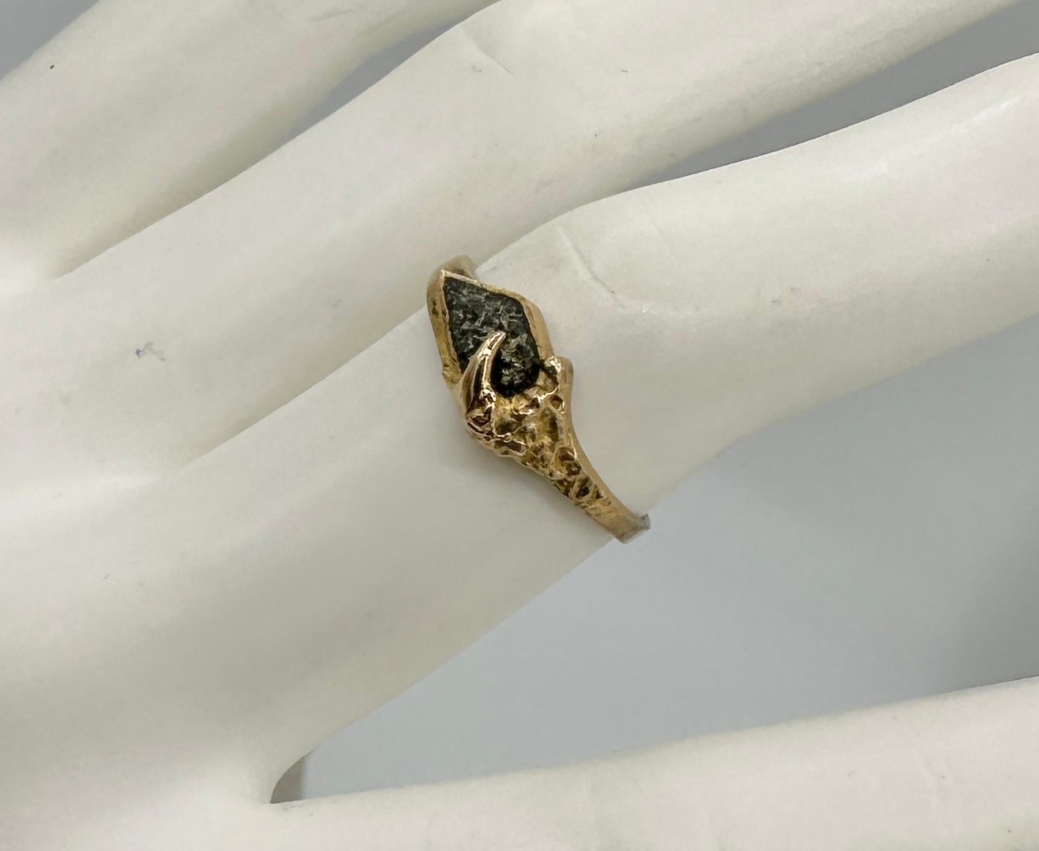 This is a rare Modernist Ring by Finnish jewelry designer Lapponia in 14 Karat Gold with a fabulous natural Calcite and a claw motif.  It is a beautiful piece of Scandinavian Mid-Century Modern jewelry.  The stunning natural Calcite gem with the