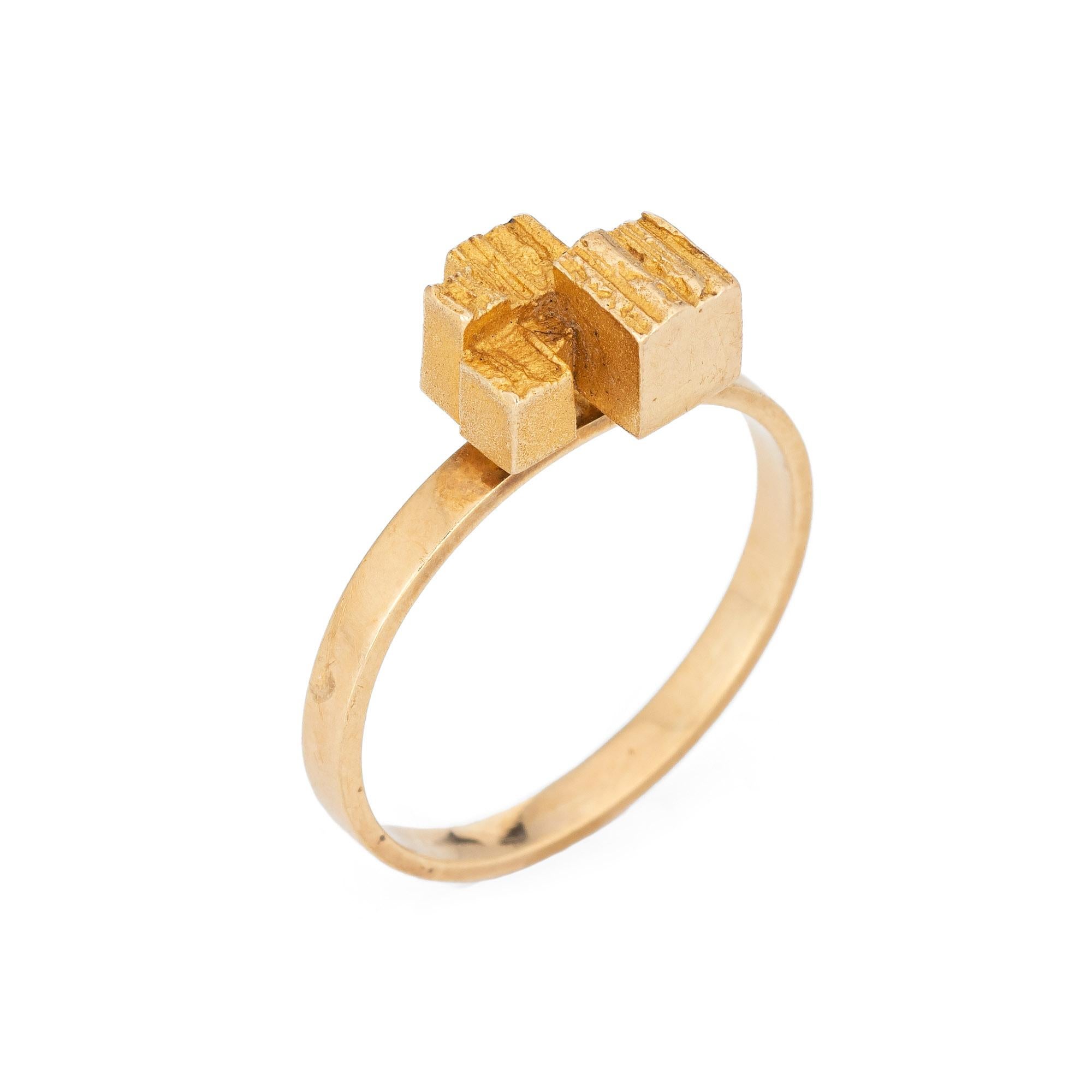 Stylish vintage Lapponia ring (circa 1960s) crafted in 18 karat yellow gold. 

Founded in the 1960s, Lapponia was developed by visionary Pekka Anttila and gifted artist & designer Björn Weckström. With a rough matte surface, the cube design is a