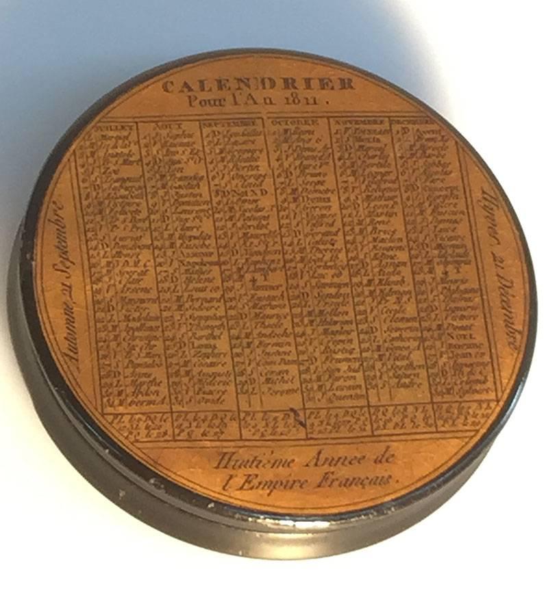 French early 19th Century lacquered papier mâché snuff box 

Lacquered Papier Mâché Snuff Box, Calendar 1811, Names of All Saints Per Day. French Calendar 1811, (Calendrier Pour L' An 1811)
Names of the Saints, every day of the Month, the whole Year