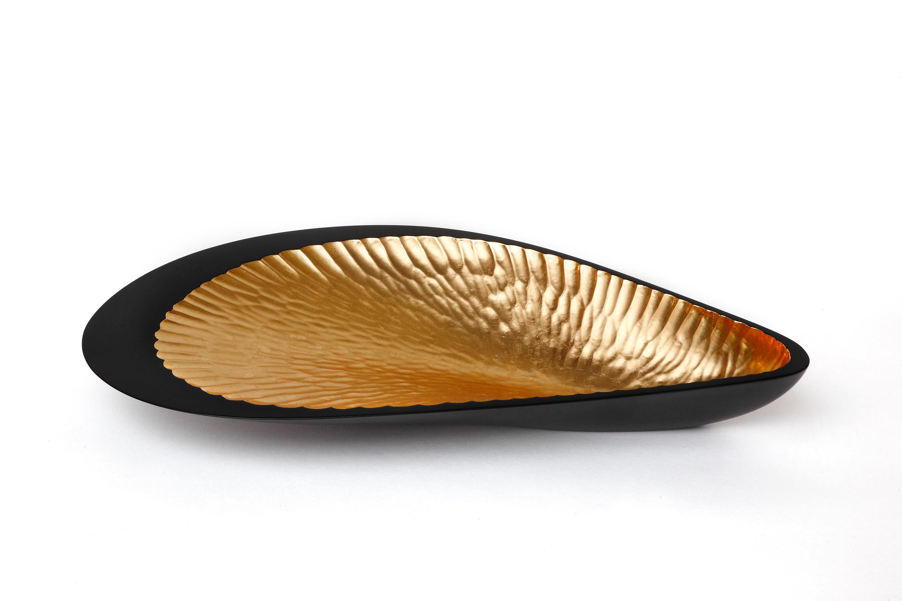 Shell sculpture in the shape of mussel made of lacquered lime wood and gold leaf. Influenced by early 20th century masters such as Majorelle, Gallé and Vallin, the artist takes the essence of the organic Art Nouveau curves and makes a transcendent