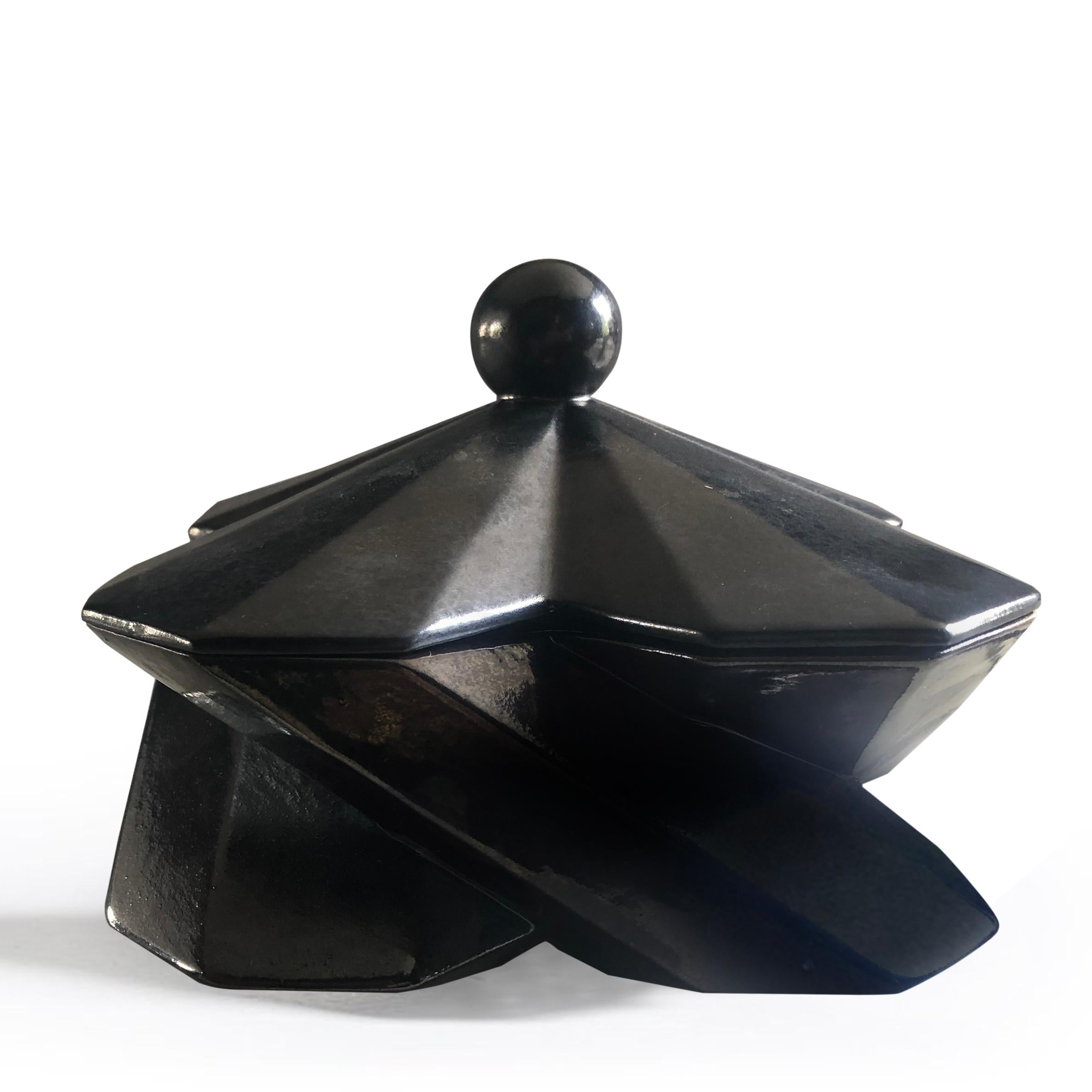 Lara Bohinc continues to work with ancient and futuristic forms with new fortress designs, further exploring the complex geometry of this range. The hexagonal shapes interlock and embrace, creating a dynamic play of light and shade on the many
