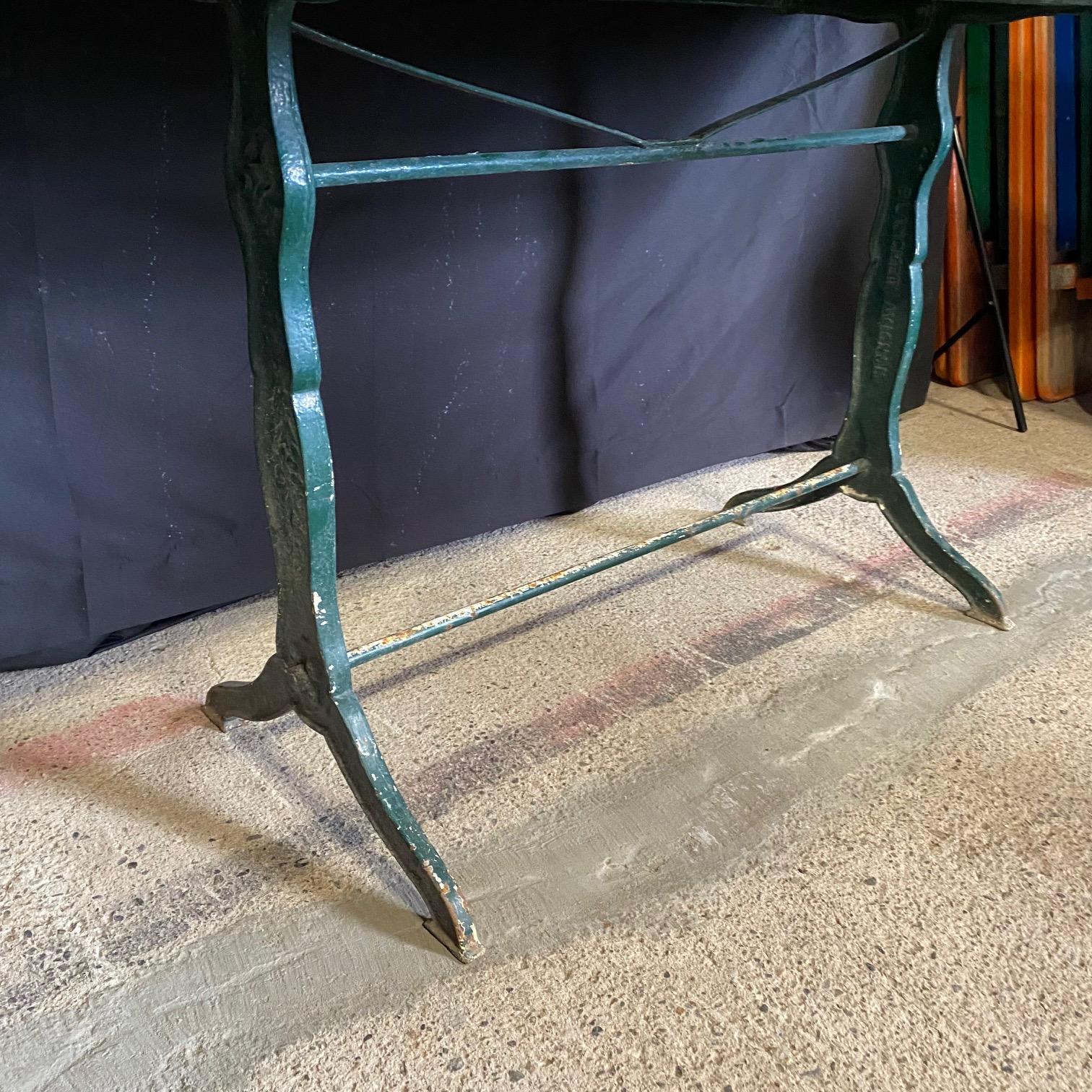Stunning large versatile French marble top rectangular cafe table or writing desk with a classic Provencal green iron base. Marble is a stunning dark green marble with lovely veining - and large!  Exudes 1920s era French bistro charm. #7209
apron