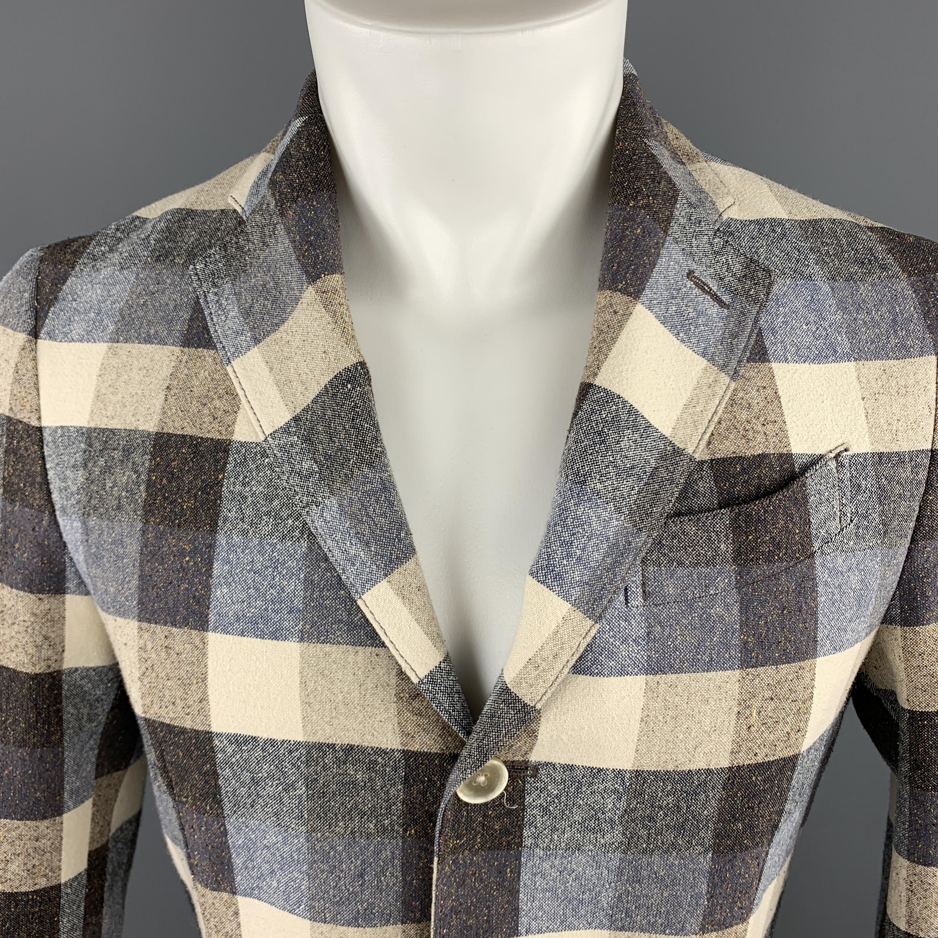 LARDINI sport coat comes in blue, beige, and taupe checkered plaid textured cotton silk blend fabric with a notch lapel, single breasted, three button front, and Patch pockets. Made in Italy.

Excellent Pre-Owned Condition.
Marked: IT