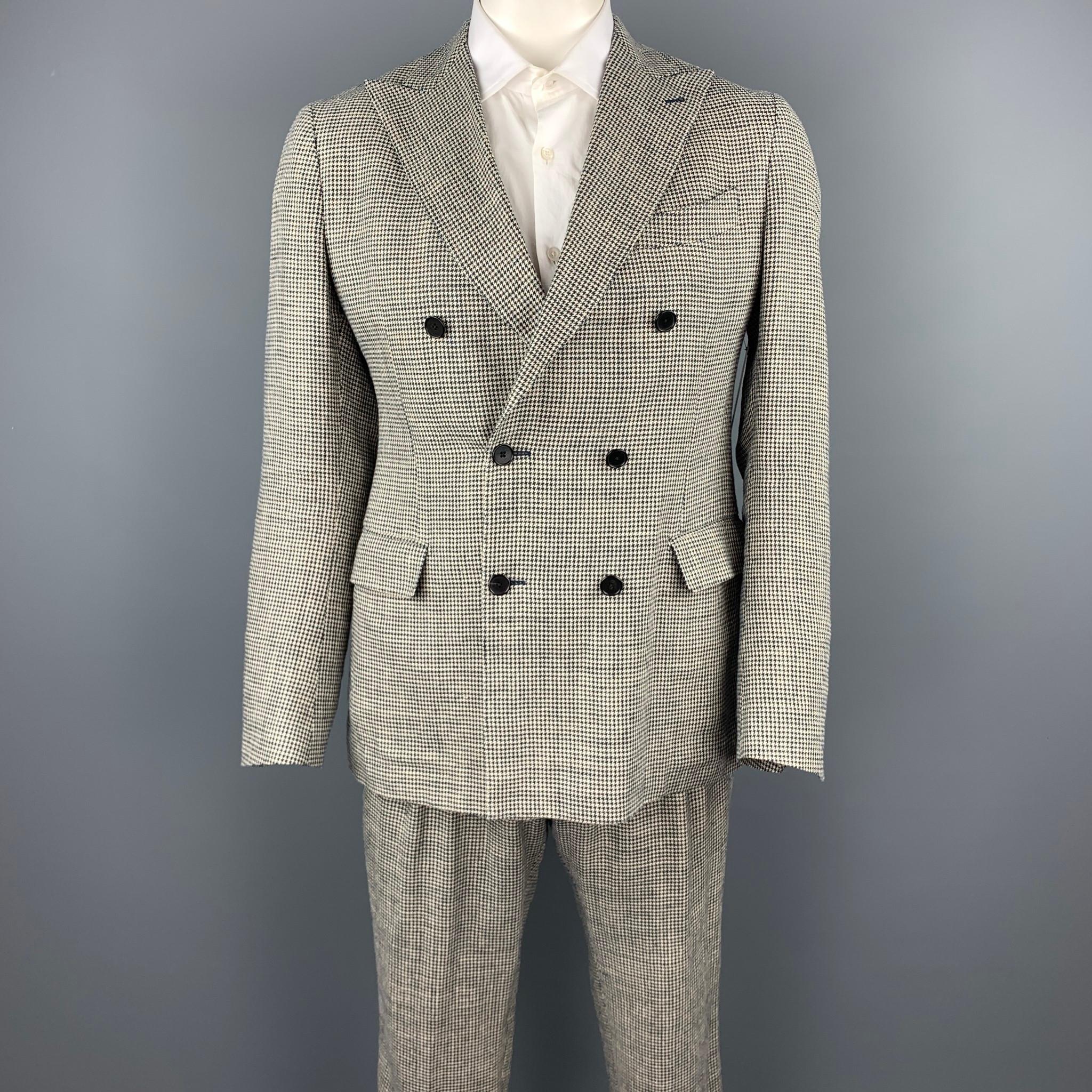 LARDINI suit comes in black & beige houndstooth silk / linen with a full liner and includes a double breasted,  button sport coat with a peak lapel and matching pleated front trousers. Made in Italy.

Very Good Pre-Owned Condition.
Marked: IT 52 R