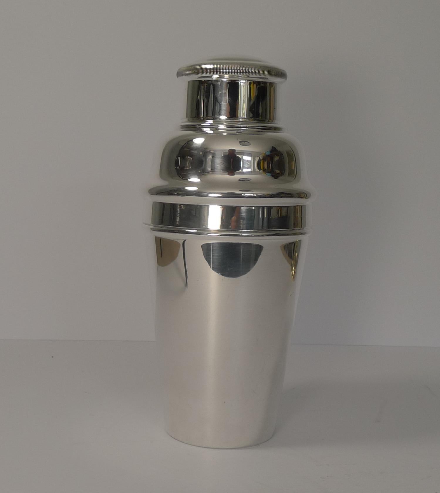 A fabulous large cocktail shaker dating to the Art Deco period, circa 1930

Just back from our silversmiths where it has been professionally restored to it's former glory, cleaned and polished, it is in lovely clean condition.

The top removed to