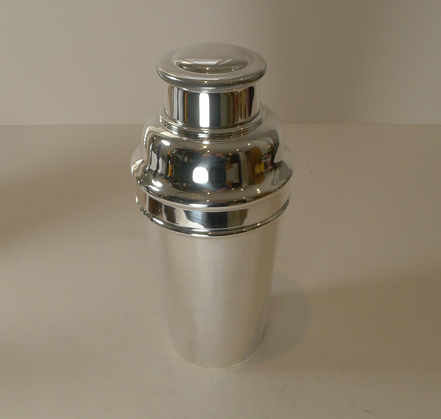 A striking large English Art Deco cocktail shaker, lovely heavy quality. 

Made from silver plate, it has just returned from our silversmith's workshop where it has been professionally cleaned and polished, restoring it to it's former glory;