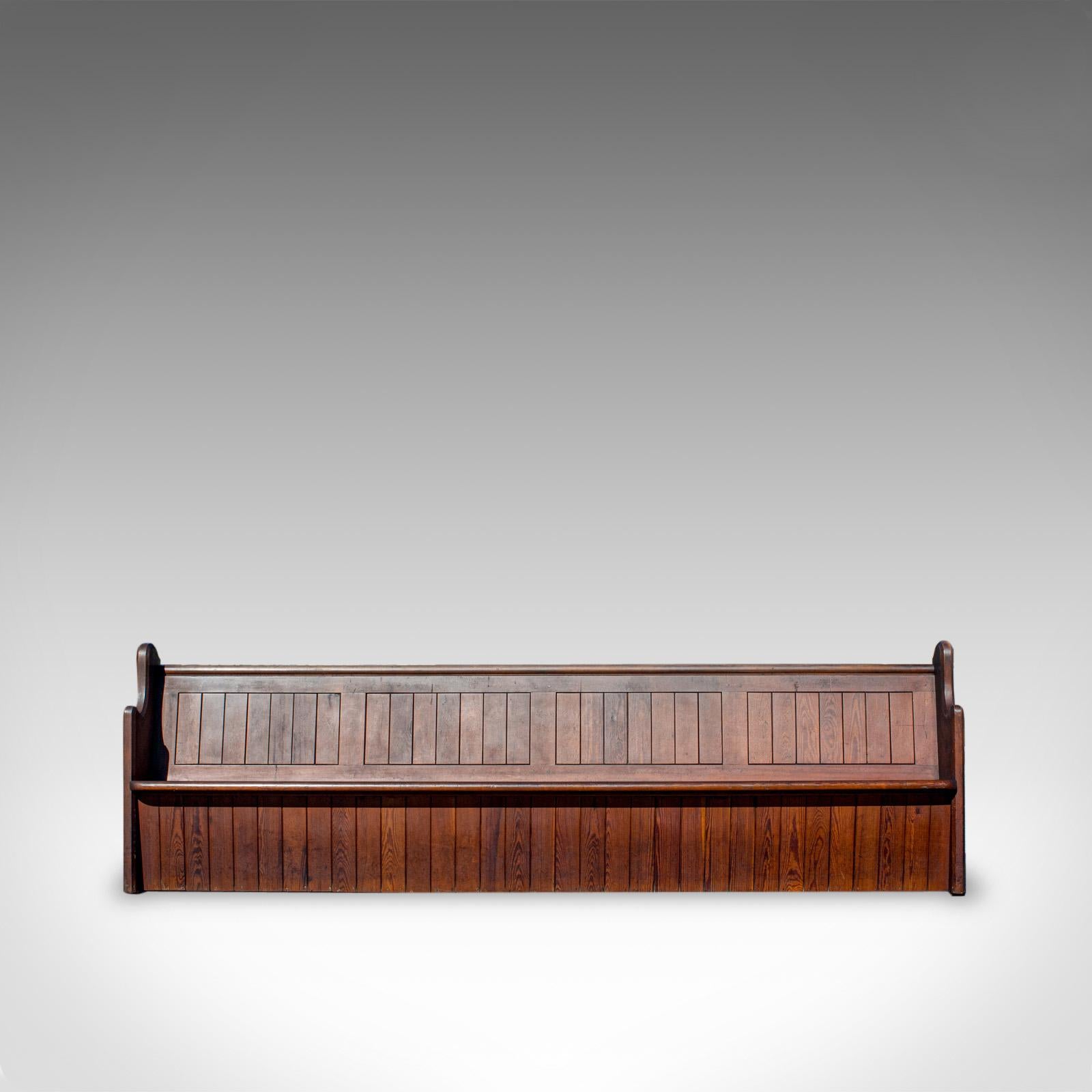 This is a large (10') antique pew. An English, pitch pine bench seat for 7-8 people and dating to the Victorian period, circa 1880.

Generous proportion at 10ft wide, seating 7-8 people
Displays a fine grain interest and desirable aged