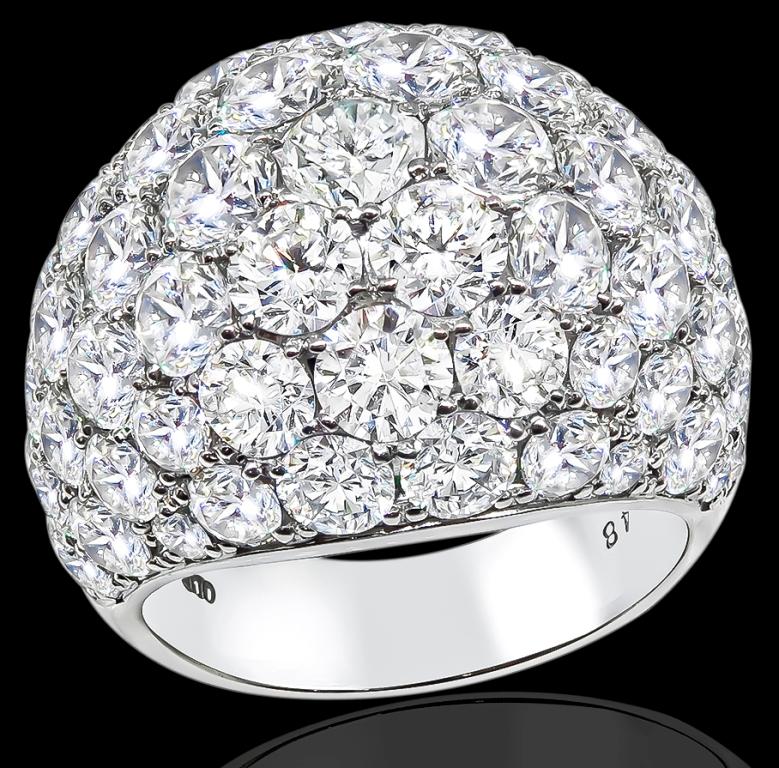 This stunning platinum ring is set with high quality sparkling round cut diamonds that weigh 10.48ct. graded F-G color with VS clarity.
The ring is stamped 'Pt900' and the diamond weight '10.48' and weighs 19.7 grams.
It is currently size 7, and can