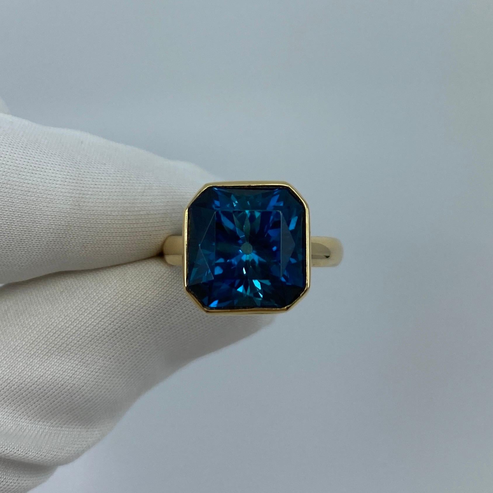 Large London Blue Topaz 18k Yellow Gold Handmade Ring.

11.93 Carat London blue topaz with a stunning deep blue colour and very good clarity. Also has a unique custom fancy square radiant cut. Measures 13mm.
Set in a beautiful handmade rubover