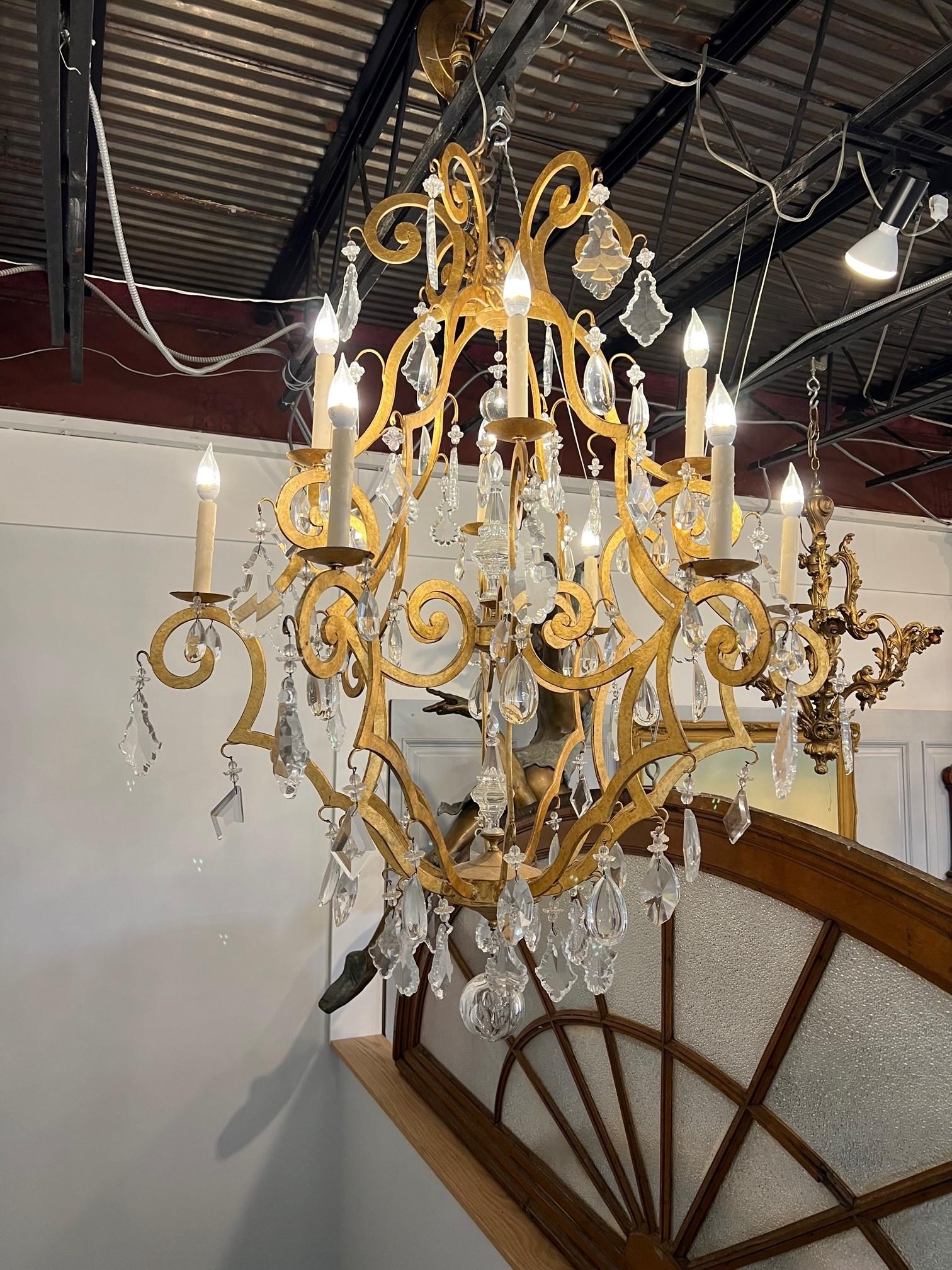 Large 12-Arm Iron and Crystal Chandelier in Gold Finish   In Good Condition For Sale In Stamford, CT