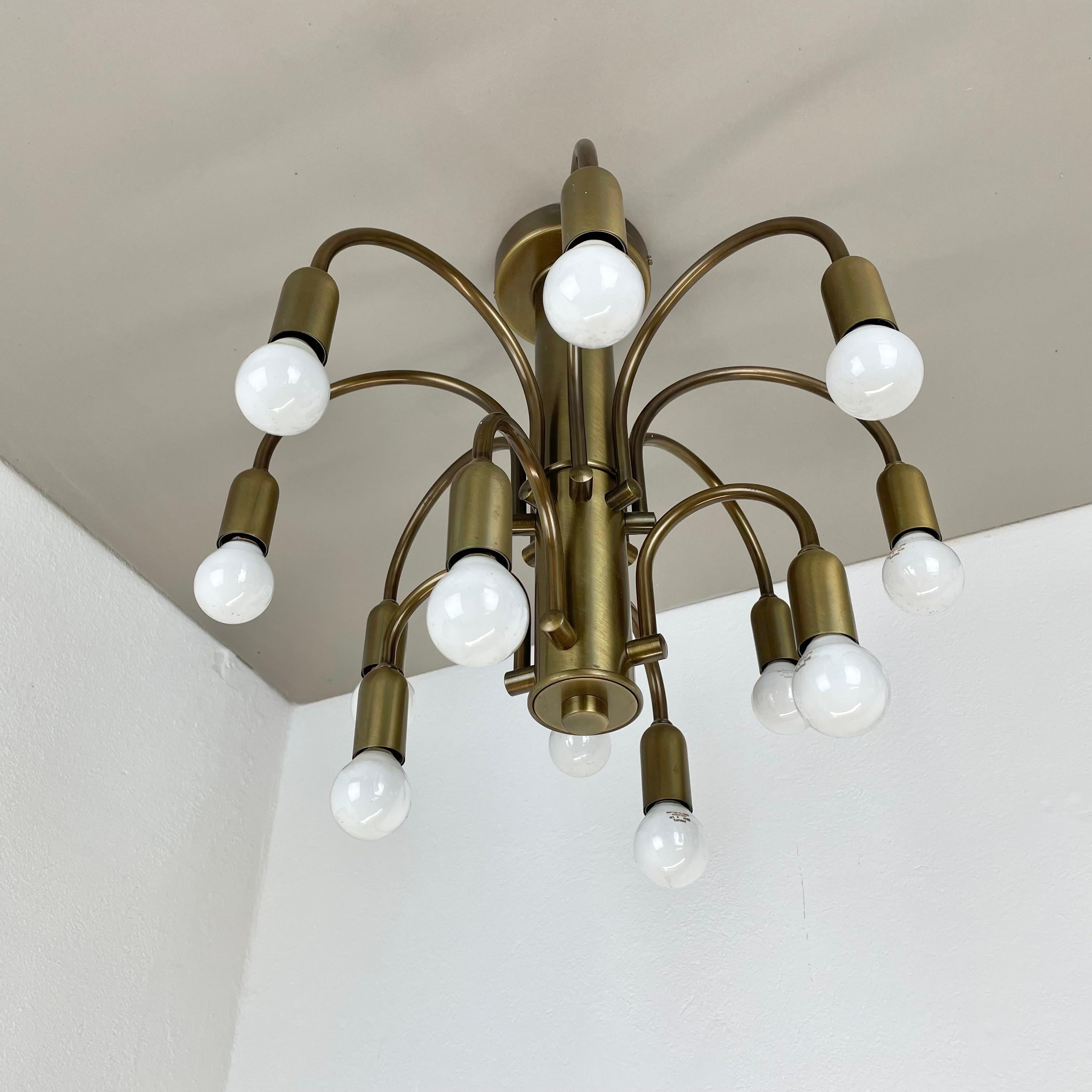 Mid-Century Modern large 12-armed solid Brass ceiling light Chandelier by WKR Lights, Germany 1970s For Sale
