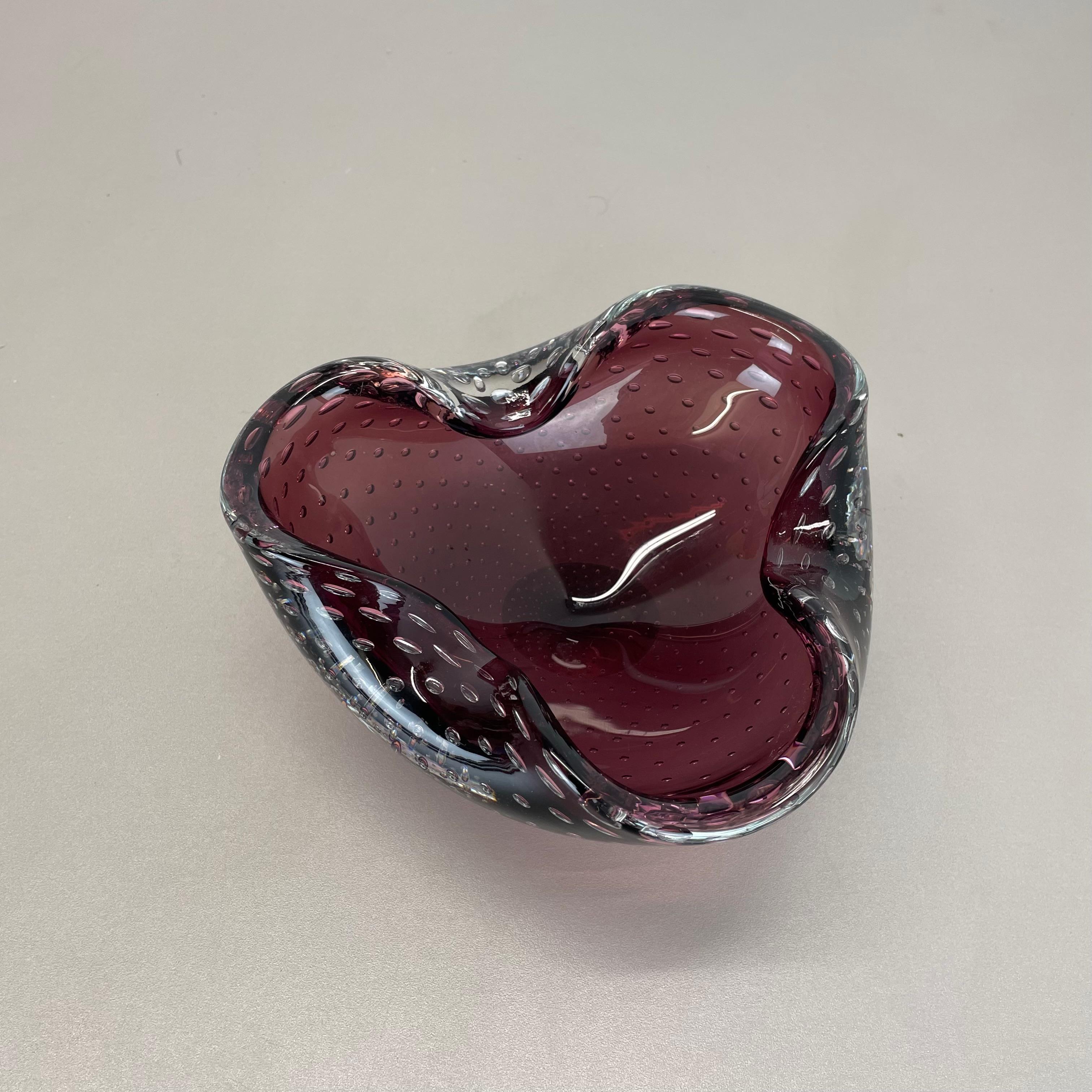 Article:

Murano glass bowl element  ashtray


Origin:

Murano, Italy


Decade:

1970s


This original glass element was produced in the 1970s in Murano, Italy. An elegant light purple Murano glass element utilizing the bullicante technique of